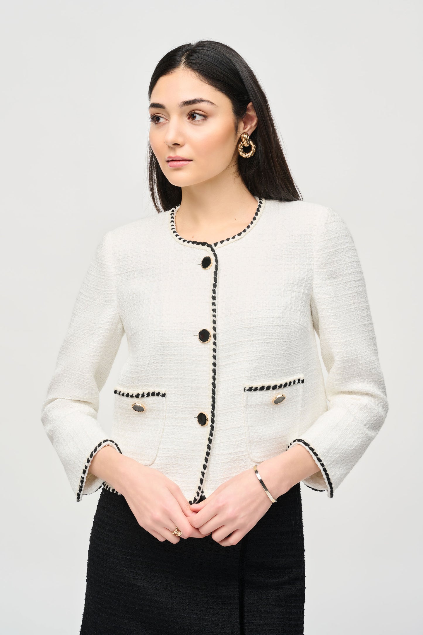 Pearls Boutique - Port Dover Ontario - Joseph Ribkoff - Bouclé Jacket With Contrast Trim 243911 - Colour Off White with black contrast piping. Designer: Joseph Ribkoff Style: Round neck jacket Pattern: Refined marled Length: Short Fit: Regular Sleeves: 3/4 length Closure: Single button Details: Impeccable buttons Occasion: Suitable for casual and semi-formal occasions Material: 95% Polyester 5% Wool Vibe: Everyday sophistication