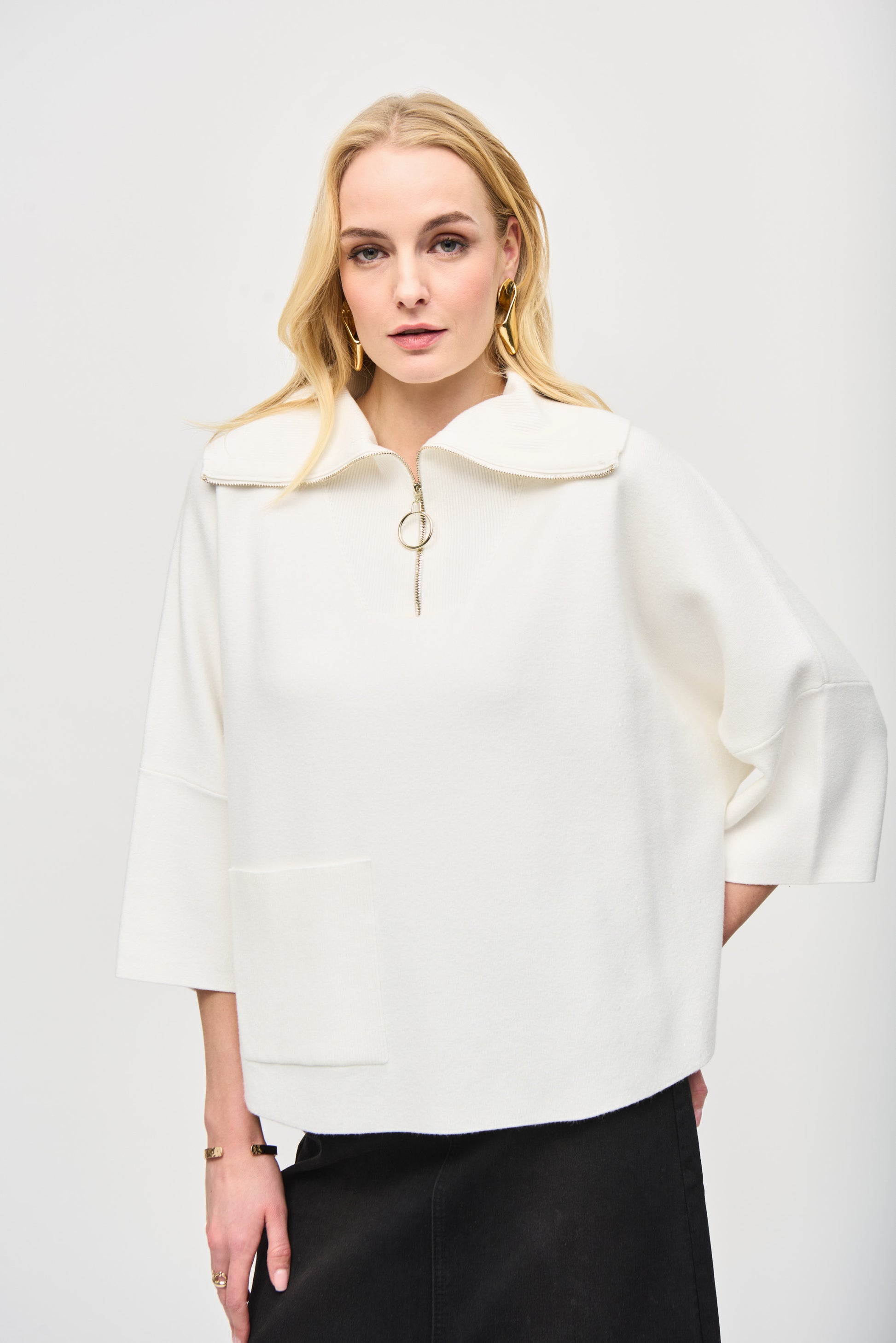 Pearls Boutique - Port Dover Ontario - Joseph Ribkoff - Jacquard Zipped Collar Sweater 243954. Off White Colour. Designer: Joseph Ribkoff Style: Casual chic top Neckline: Cutaway Fit: Oversized Length: Short Sleeves: 3/4 dolman Design: Plain with cool zipper element Occasion: Daily wear Material: 50% Viscose Rayon 30% Polyester 20% Nylon