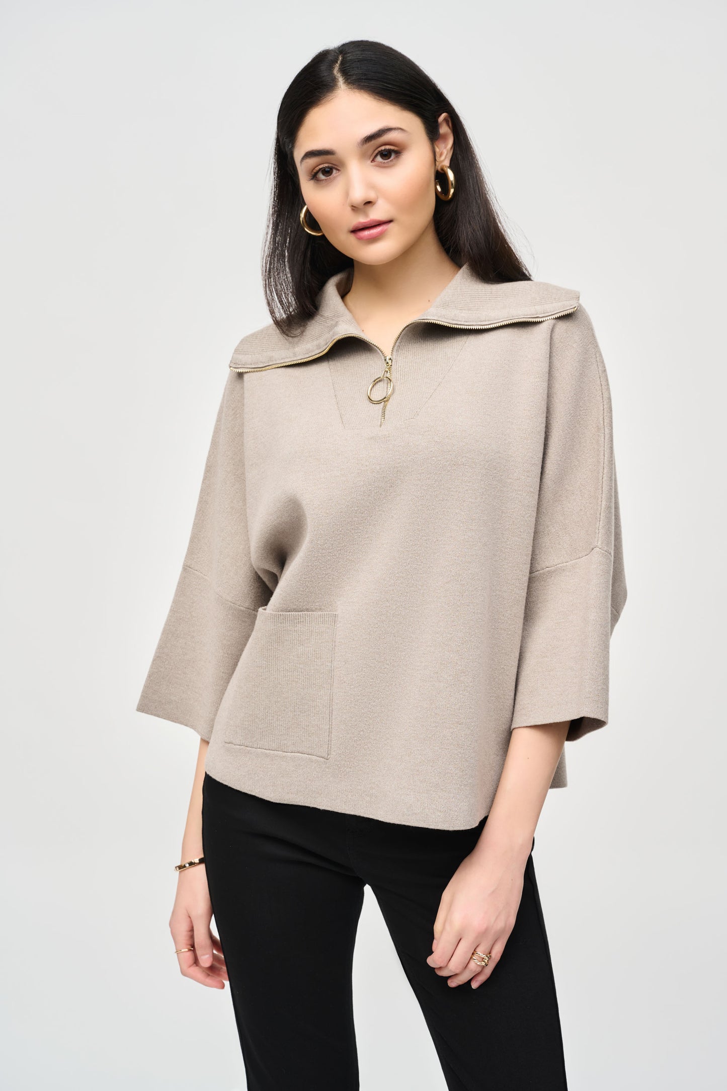 Pearls Boutique - Port Dover Ontario - Joseph Ribkoff - Jacquard Zipped Collar Sweater 243954. Off Taupe Colour. Designer: Joseph Ribkoff Style: Casual chic top Neckline: Cutaway Fit: Oversized Length: Short Sleeves: 3/4 dolman Design: Plain with cool zipper element Occasion: Daily wear Material: 50% Viscose Rayon 30% Polyester 20% Nylon