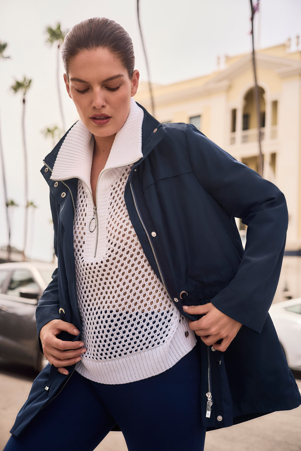 Joseph Ribkoff Navy lightweight jacket over a white mesh zip collar top. Available at Pearls Boutique Port Dover, Ontario.