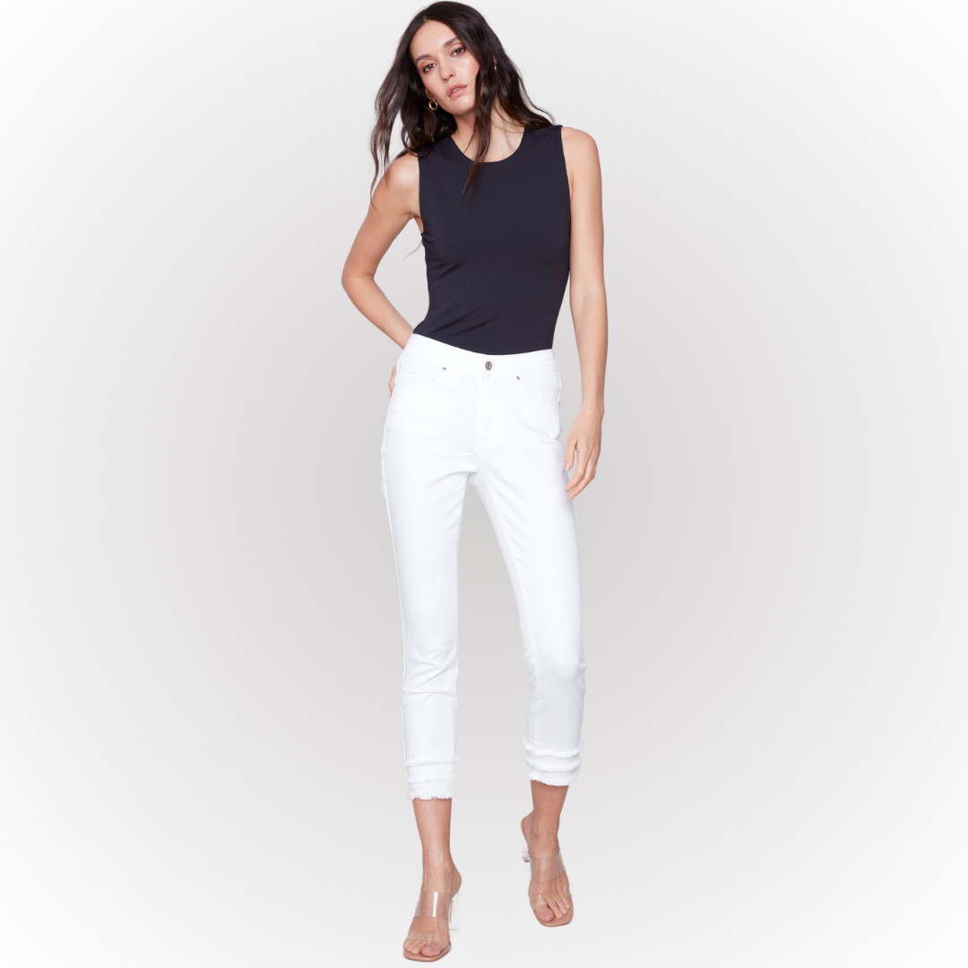 Pearls Boutique - Port Dover Ontario - The Charlie B Fringe detail crop   is a white 5 pocket,  Fly Front,  high rise jeans  cropped in length with a fun double fringe detail at the hem. Perfect to pair with you fav flip flops or heels.