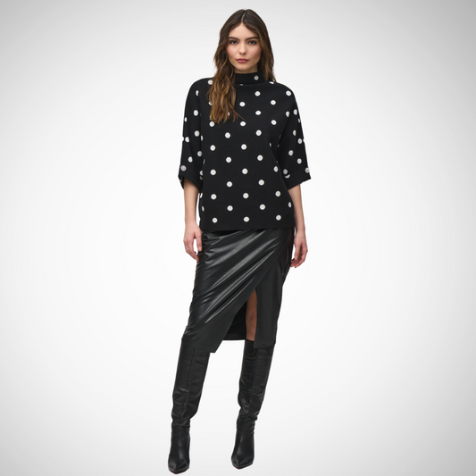 Pearls Boutique -Port Dover Ontario - Joseph RIbkoff - Polka Dot Sweater -  Chic and cozy pullover with timeless appeal Classic black and white polka dot print 3/4 length sleeves for a versatile look Stylish funnel neckline Crafted from a blend of materials: 54% viscose rayon 31% polyester 15% nylon Ensures both comfort and durability