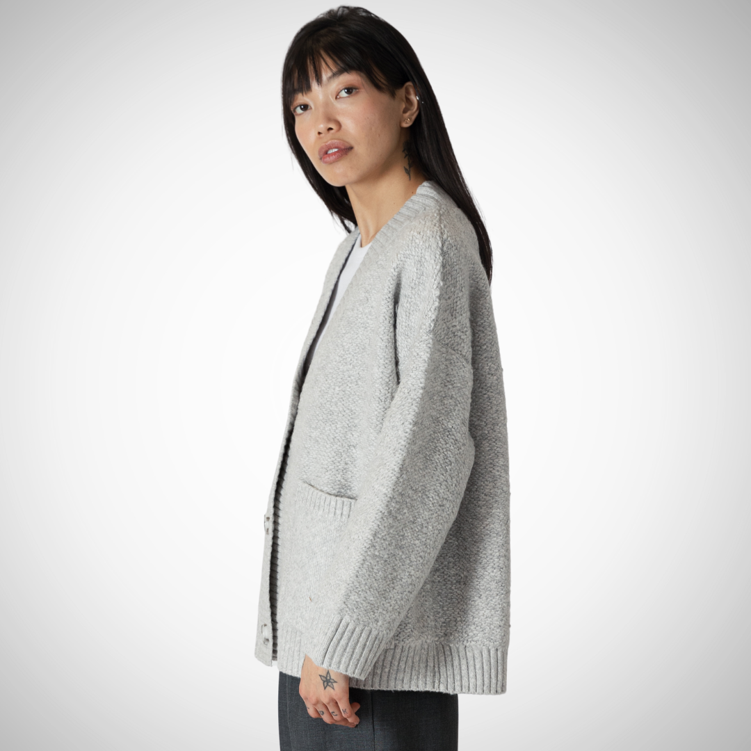 Pearls Boutique - Port Dover Ontario - Lyla + Lux  Silva Boucle Jacket - Light Heather Grey. Boxy boyfriend cut bouclé jacket Oversized and relaxed fit, ideal for layering Convenient pockets for added functionality and style Versatile design for casual or dressed-up occasions Made of 68% Acrylic, 28% Polyester, and 4% Elastane for chic comfort