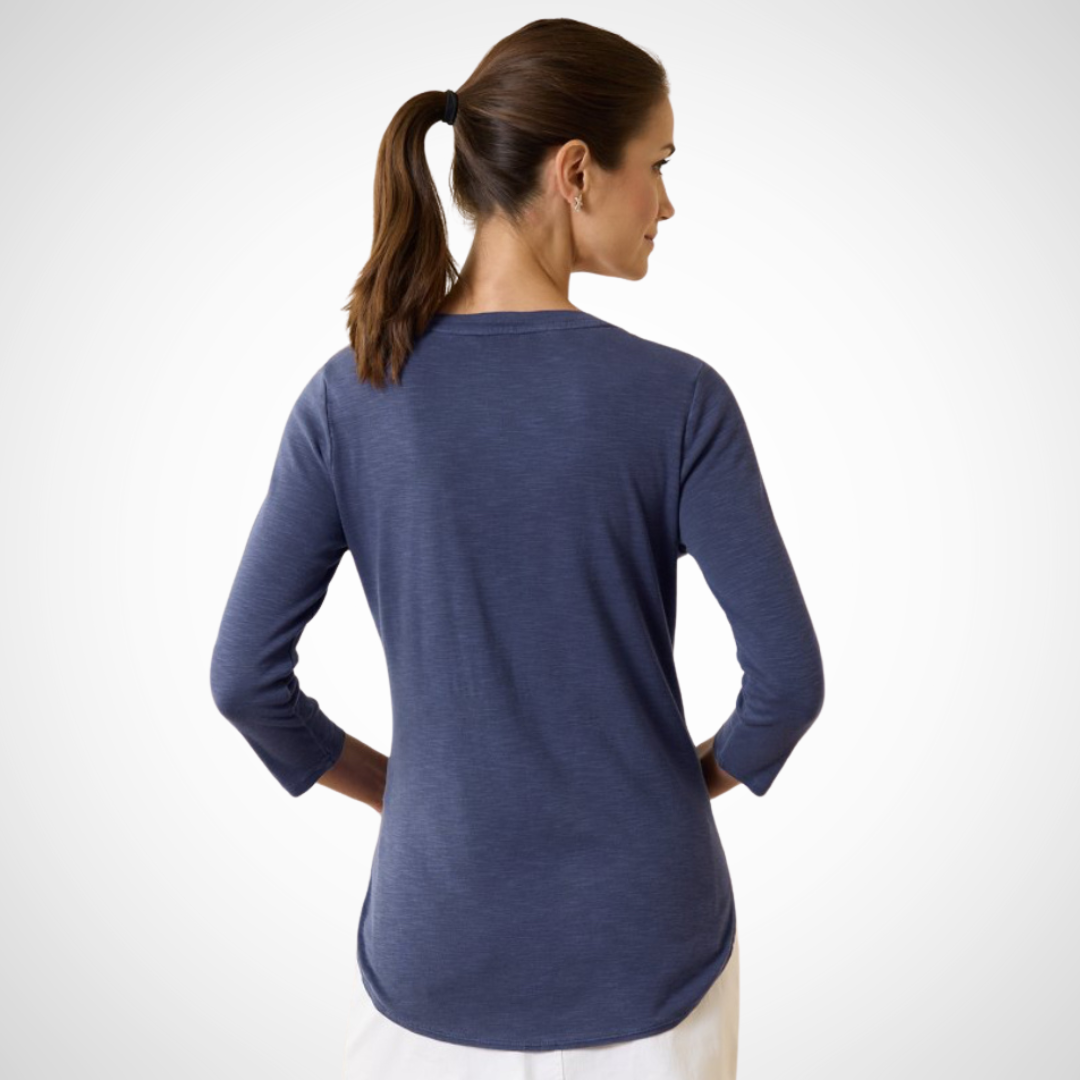 Pearls Boutique Port Dover Ontario - Ashby Isles 3/4 Sleeve Tee - Colour - Navy. Experience the delightful sensation of our soft, micro-rib cotton against your skin, enhanced by its relaxed slubbed texture. The shirt's hem with a stylish tail and ¾-length sleeves further contribute to its laid-back charm. Made entirely of cotton, it is easy to care for—simply machine wash on a gentle cycle and tumble dry on a low setting. Avoid dry cleaning for optimal maintenance.