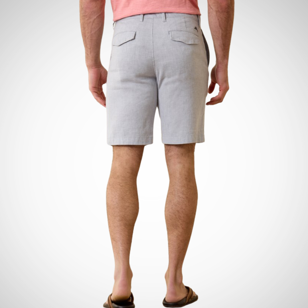 Pearls Boutique - Port Dover Ontario - Tommy Bahama - Mens Shorts - 10 Inch length, Flat Front, Fly and belt loops, 10 inch length, pockets. The Mens Tommy Bahama Beach Coast Linen Shorts will make a valuable addition to your wardrobe, thanks to the added stretch and multiple pockets for all your beachcombing needs. Made with a blend of 61% linen, 37% cotton, and 2% spandex, with a 10 inch flat front length.