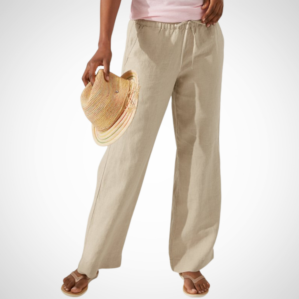 Pearls Boutique Port Dover Ontario - Tommy Bahama - Two Palms Easy Pant. perfect for comfort and style. Ideal for lounging oceanside or socializing with friends. Made from 100% linen for a breathable feel. Features an inseam of 31 inches and an elastic waistband with a drawstring for a customizable fit. Includes front pockets for added convenience. Designed to be an easy fit; consider ordering a size down for a less generous fit. Colour Natural 