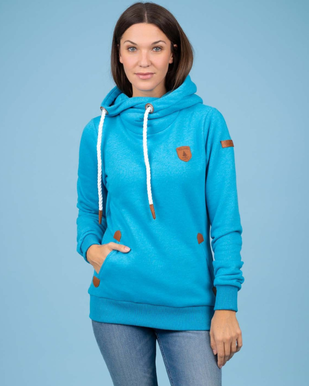 Pearls Boutique - Port Dover Ontario - Wanakome - Artemis Hoodie.  colour lagoon blue . Women’s Wanakome Artemis sweatshirt with cowl neck and rope drawstrings,  heavy fleece with vegan leather accents and front pockets."