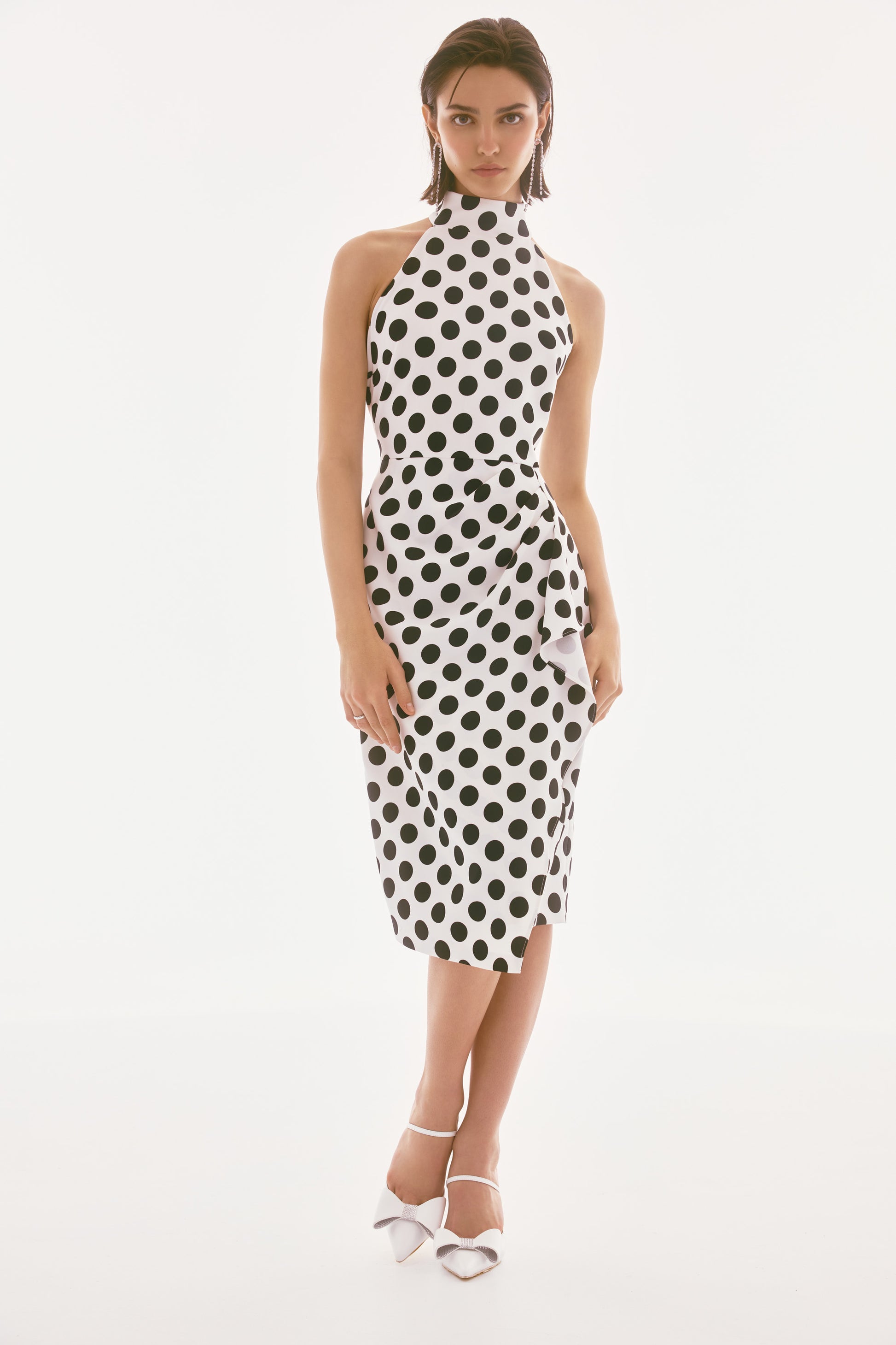 Pearls Boutique-PortDover Ontario- Joseph Ribkoff- Dotted Twill Halter Dress.90% Polyester, 10% Spandex
Woven twill fabric
Dotted print
Halter mock neck
Sleeveless
Pleated draped cascade detail
Center back slit
Back zipper closure
Lined
Hand wash in cold water with like colors
Do not bleach
Hang to dry in the shade
Do not tumble dry
Do not iron
Do not dry clean
Wash garment inside out