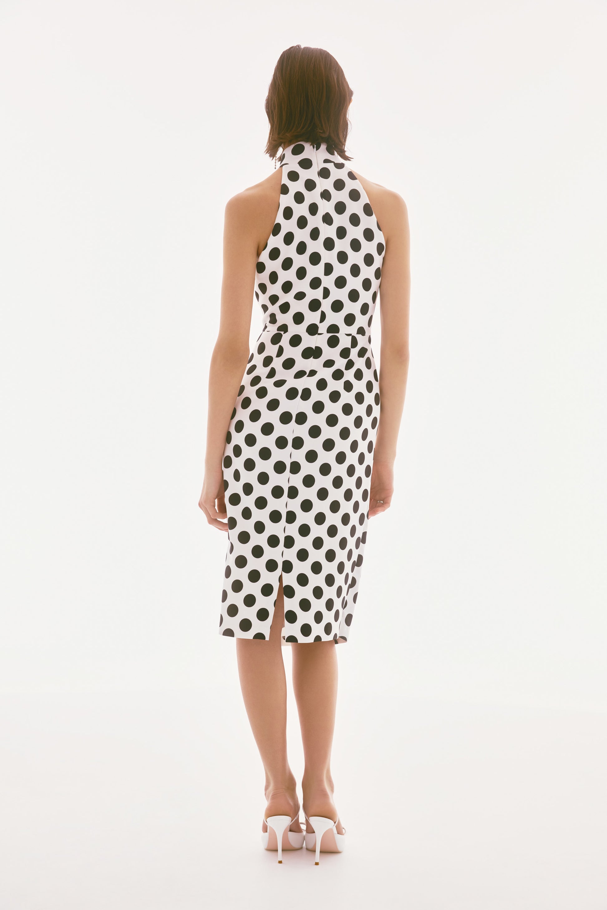 Pearls Boutique-PortDover Ontario- Joseph Ribkoff- Dotted Twill Halter Dress.90% Polyester, 10% Spandex
Woven twill fabric
Dotted print
Halter mock neck
Sleeveless
Pleated draped cascade detail
Center back slit
Back zipper closure
Lined
Hand wash in cold water with like colors
Do not bleach
Hang to dry in the shade
Do not tumble dry
Do not iron
Do not dry clean
Wash garment inside out