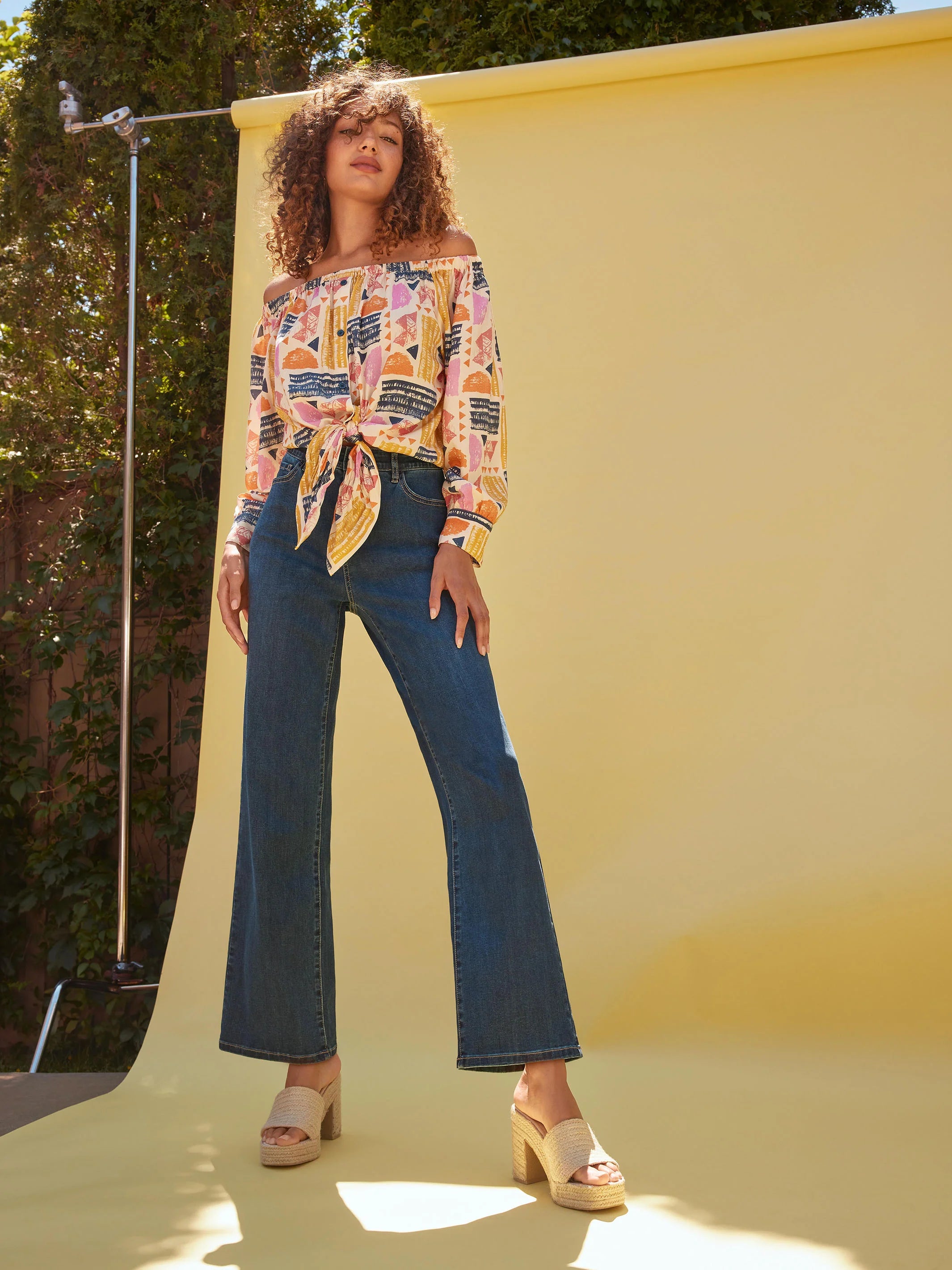 Pearls Boutique-Port Dover Ontario-Charlie B-Off-The-Shoulder Printed Blouse with Front Tie - Batik.
Vibrant off-the-shoulder blouse featuring a playful batik-inspired print. 100% viscose,lightweight and airy top,relaxed fit ,button-down front and front tie knot for a chic touch.  long sleeves.
