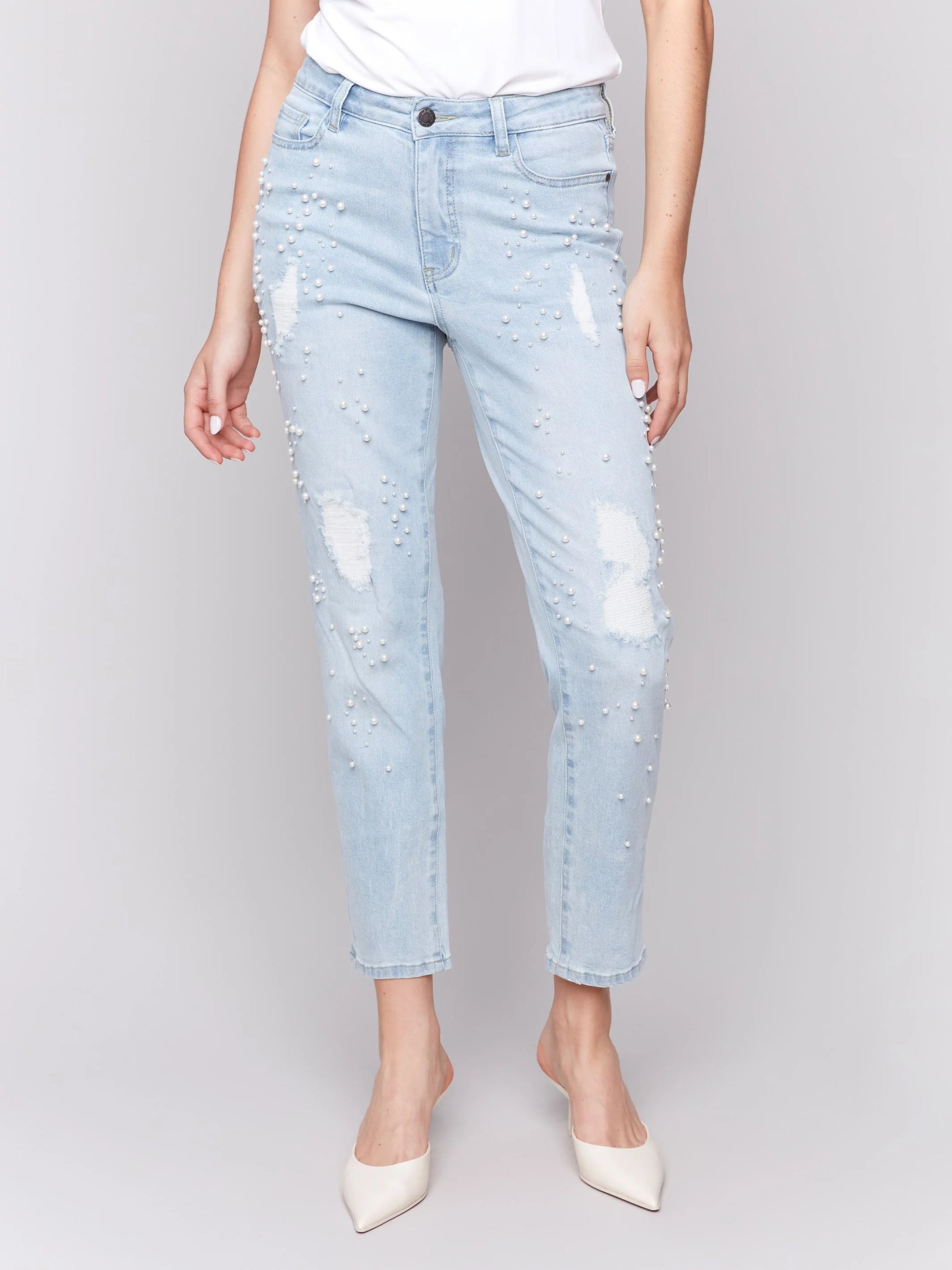 Pearls Boutique-Port Dover Ontario-Charlie B Pearl Applique Slim-Leg Jeans with Distressed Detail-light Blue-Style C5617-301B
Light blue slim-fit jeans with ankle-length cut

Distressed details with delicate pearl appliqué

Regular-rise waist for a flattering fit

Five-pocket design for everyday functionality
Made from stretch denim for comfort and flexibility

Chic blend of elegance and edgy style