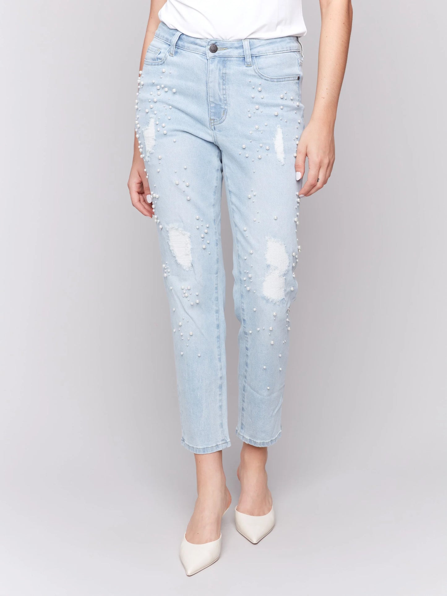 Pearls Boutique-Port Dover Ontario-Charlie B Pearl Applique Slim-Leg Jeans with Distressed Detail-light Blue-Style C5617-301B
Light blue slim-fit jeans with ankle-length cut

Distressed details with delicate pearl appliqué

Regular-rise waist for a flattering fit

Five-pocket design for everyday functionality
Made from stretch denim for comfort and flexibility

Chic blend of elegance and edgy style