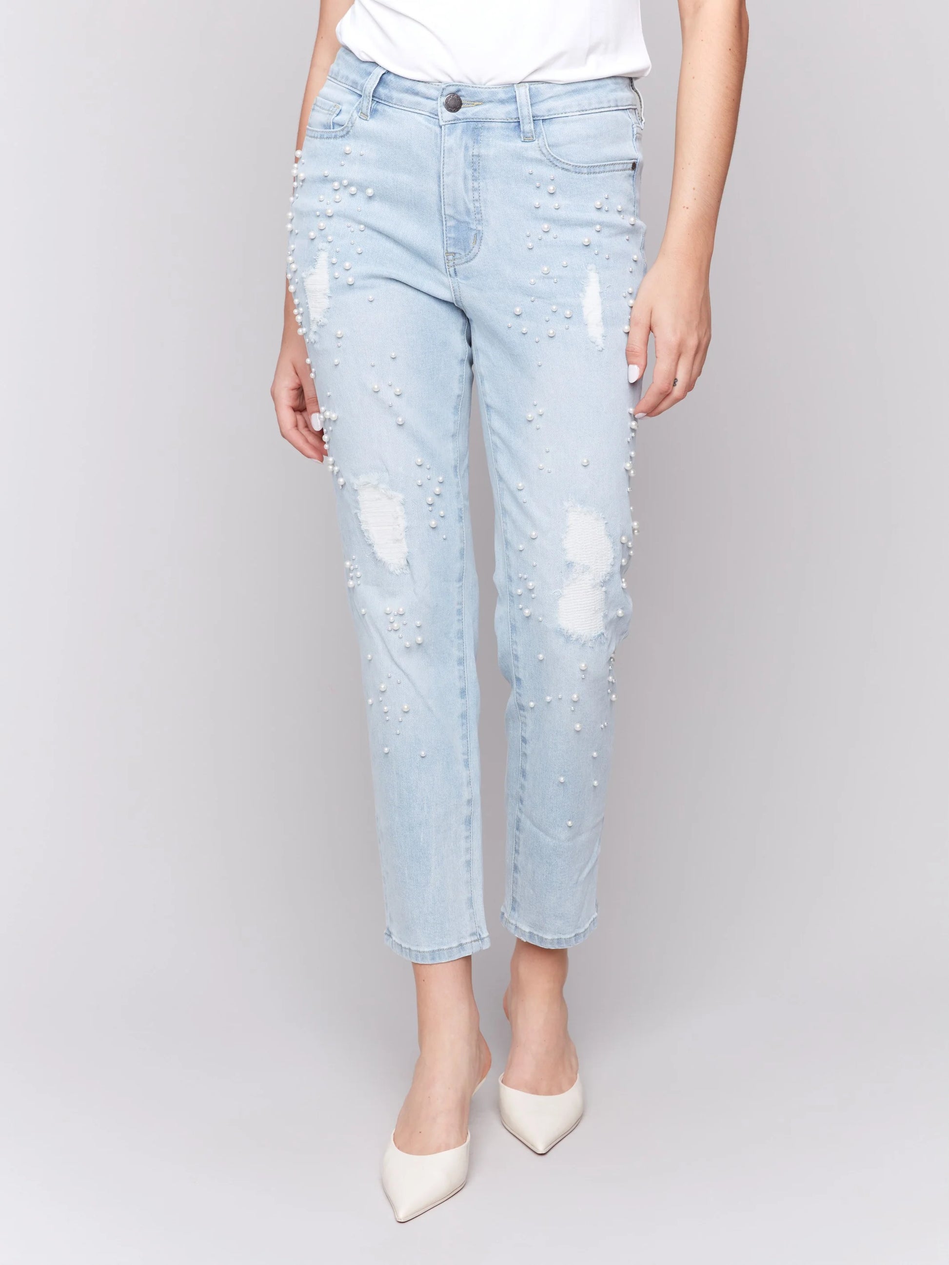 Pearls Boutique-Port Dover Ontario-Charlie B Pearl Applique Slim-Leg Jeans with Distressed Detail-light Blue-Style C5617-301B
Light blue slim-fit jeans with ankle-length cut

Distressed details with delicate pearl appliqué

Regular-rise waist for a flattering fit

Five-pocket design for everyday functionality
Made from stretch denim for comfort and flexibility

Chic blend of elegance and edgy style