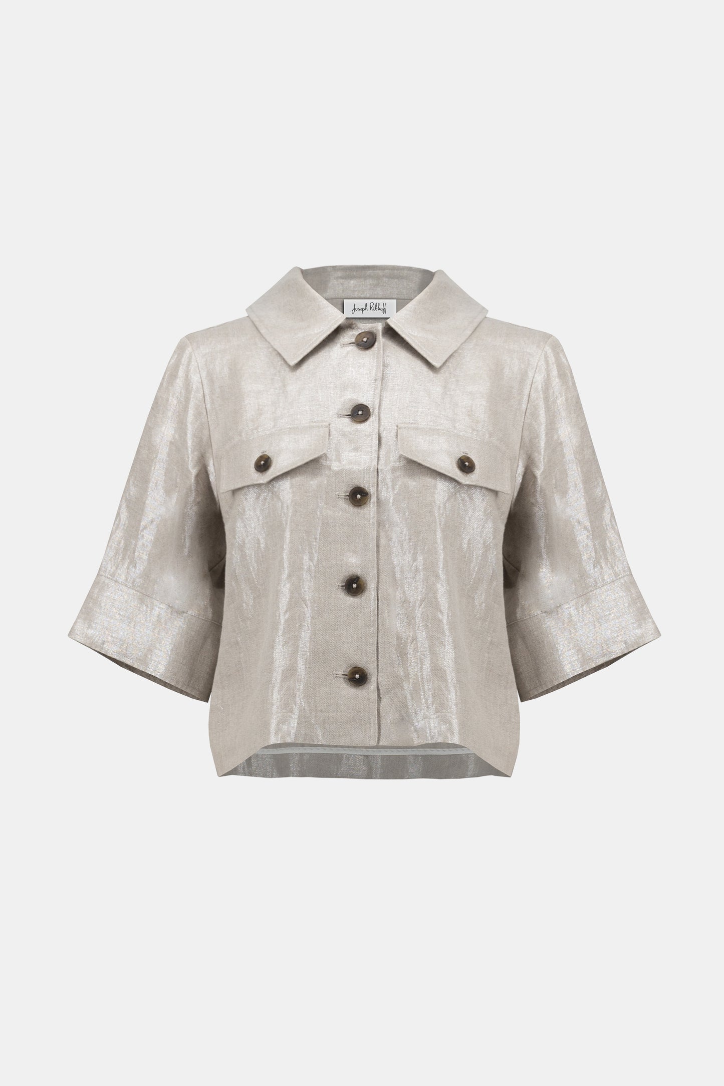 Pearls Boutique-Port Dover Ontario-Joseph Ribkoff-Foiled Linen Jacket-252921.A 100% linen Jacket in a pale gold woven foiled linen blend fabric, featuring a classic shirt collar and 3/4 cuffed sleeves. Designed with a front button closure, flap chest pockets, and contrast buttons. Unlined with a cropped boxy silhouette for a relaxed fit. Can be worn as a shirt or layered as a jacket. Care instructions include hand washing in cold water, avoiding bleach and tumble drying, and low ironing only if needed.