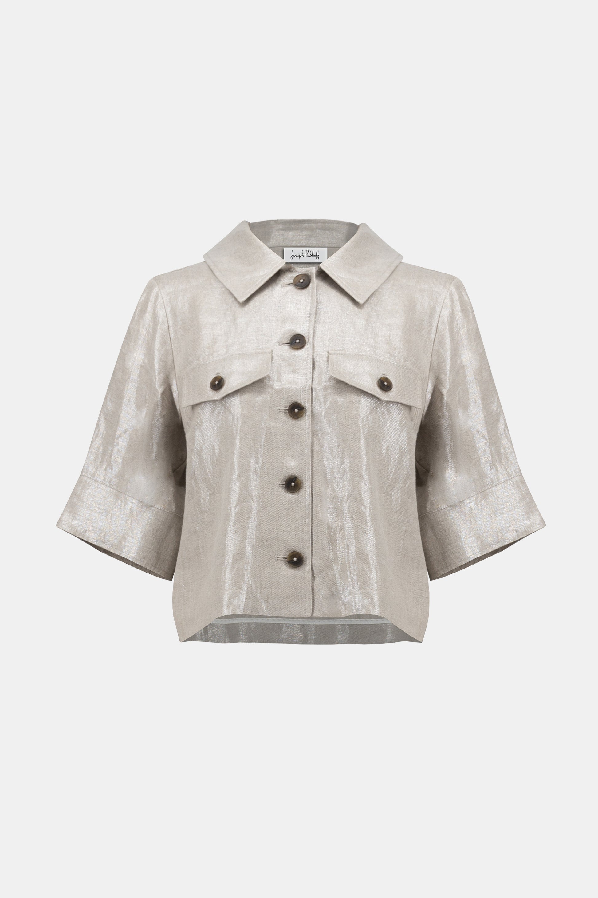Pearls Boutique-Port Dover Ontario-Joseph Ribkoff-Foiled Linen Jacket-252921.A 100% linen Jacket in a pale gold woven foiled linen blend fabric, featuring a classic shirt collar and 3/4 cuffed sleeves. Designed with a front button closure, flap chest pockets, and contrast buttons. Unlined with a cropped boxy silhouette for a relaxed fit. Can be worn as a shirt or layered as a jacket. Care instructions include hand washing in cold water, avoiding bleach and tumble drying, and low ironing only if needed.