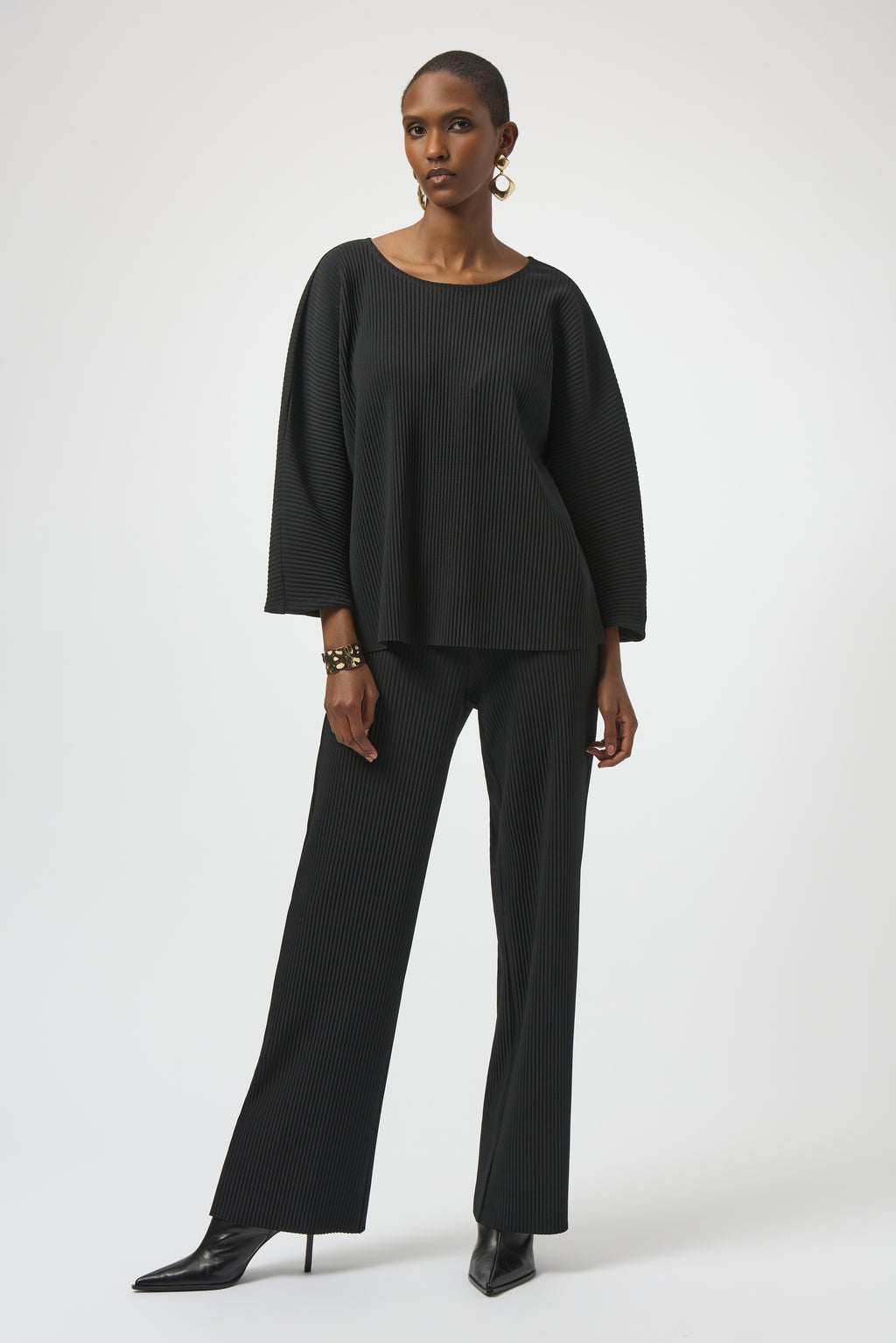 Pearls Boutique-Port Dover Ontario-Joseph Ribkoff | Pleated Scuba Crepe Boxy Top-Colour Black
– Lightweight scuba crepe with subtle structure
– Delicate pleating for added movement and dimension
– Flattering scoop neckline with soft drape
– Three-quarter dolman sleeves for a contemporary finish
– Relaxed, boxy silhouette for all-day comfort