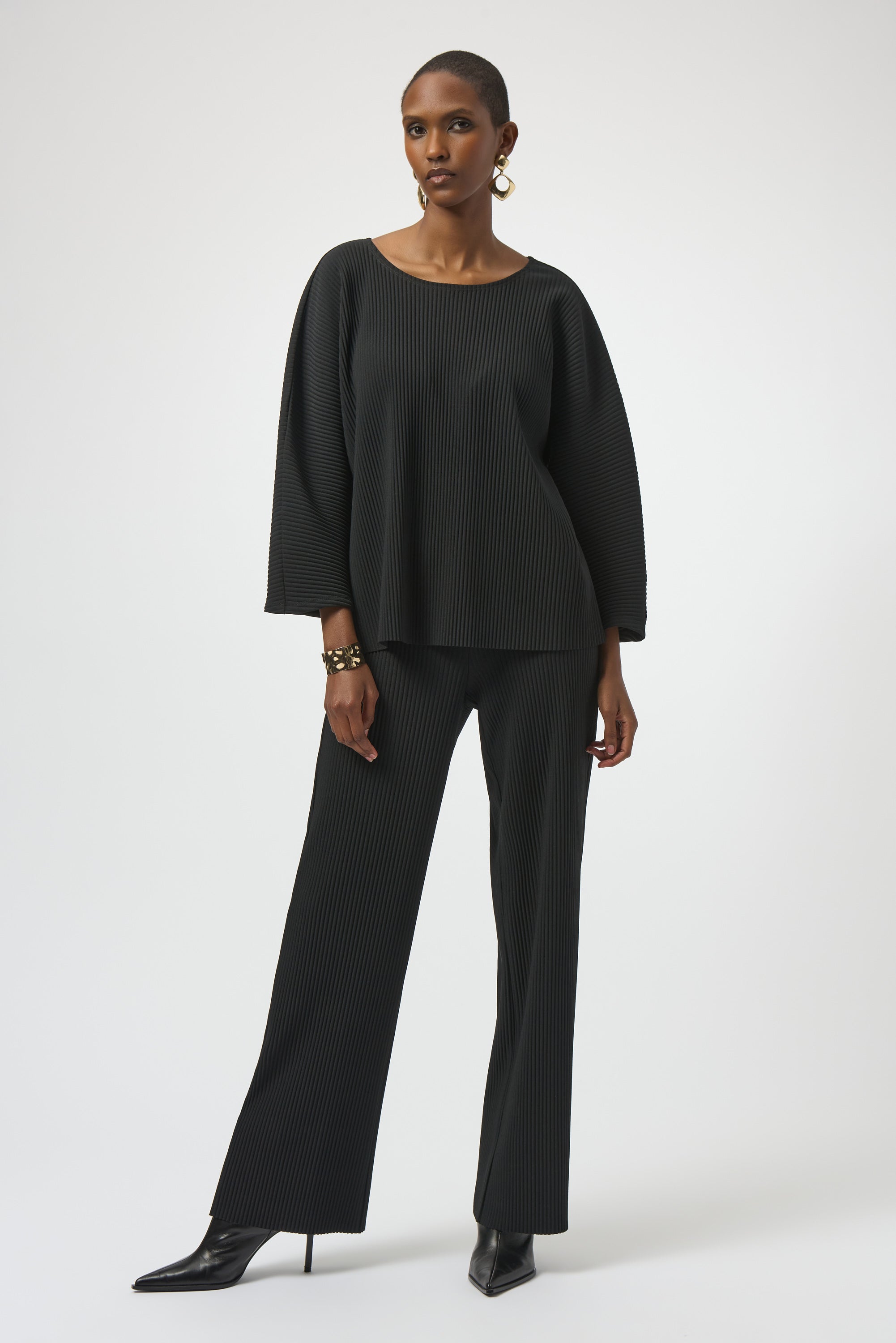 Pearls Boutique-Port Dover Ontario-Joseph Ribkoff | Pleated Scuba Crepe Boxy Top-Colour Black
– Lightweight scuba crepe with subtle structure
– Delicate pleating for added movement and dimension
– Flattering scoop neckline with soft drape
– Three-quarter dolman sleeves for a contemporary finish
– Relaxed, boxy silhouette for all-day comfort