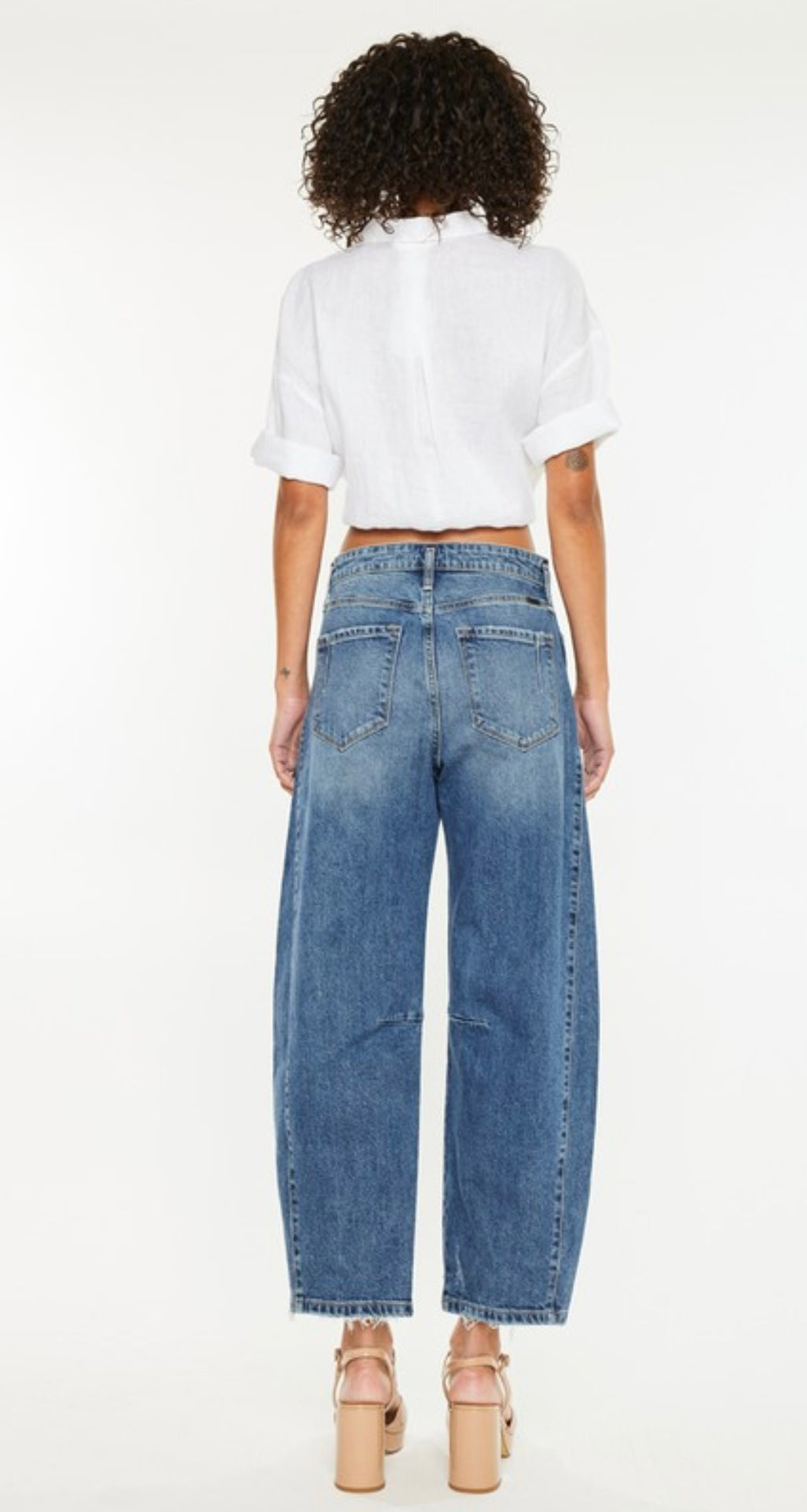 Pearls Boutique-Port Dover Ontario-Low-slung horseshoe fit jeans, dark wash, comfort stretch, zipper fly, belt loops shifted down, faux welt pockets, light orchid tint

Oversized fit with barrel leg and tapered bottom

Rise 12"&nbsp;

Inseam 17"

84% Cotton, 15% Lyocell, 1% Spandex

11.5 OZ