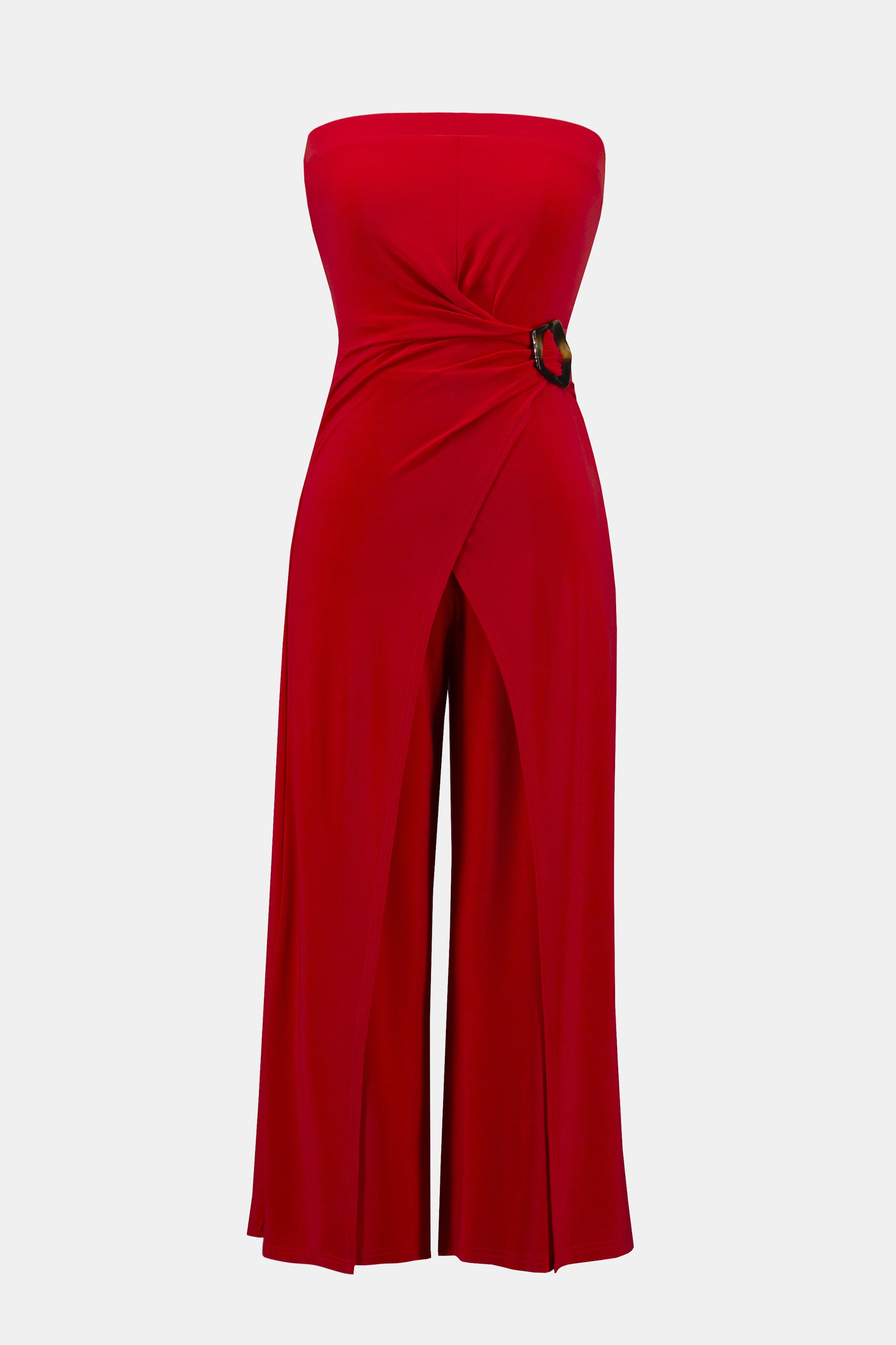 Pearls Boutique- Port DoverOntario-Joseph Ribkoff- Red silky knit strapless culotte jumpsuit-252083 featuring a bandeau-style bodice with hidden elastic for a perfect fit. Designed with a faux wrap detail and a wide-leg silhouette that adds grace to every movement, the side is elegantly draped and adorned with a faux tortoise shell buckle for a dramatic flair. Unlined for a lightweight feel. Made from 95% polyester and 5% spandex, with easy-care instructions: hand wash, hang to dry, and low iron if needed.