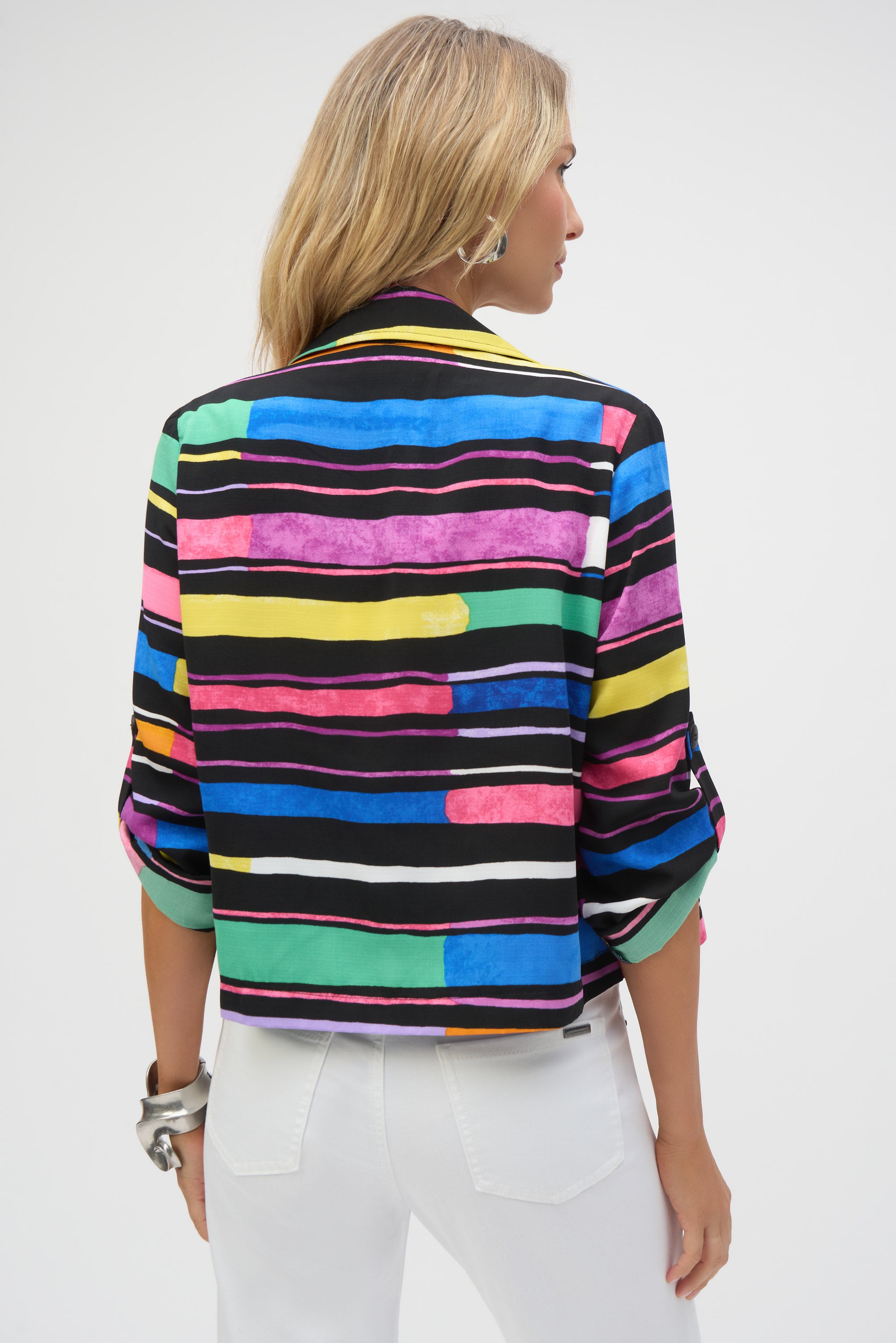 Pearls Boutique- Port Dover Ontario-Joseph Ribkoff-Joseph Ribkoff - Gauze Stripe Print Short Boxy Blazer-252215-178.A vibrant striped blazer made from woven gauze, featuring an open front, classic notched collar, and three-quarter sleeves with buttoned tabs. Designed with a cropped, boxy silhouette for a bold statement look. Unlined for a lightweight feel. Model is 5'9" and wearing size 6. Body length from the high point of the shoulder: 22" (55.88 cm).








