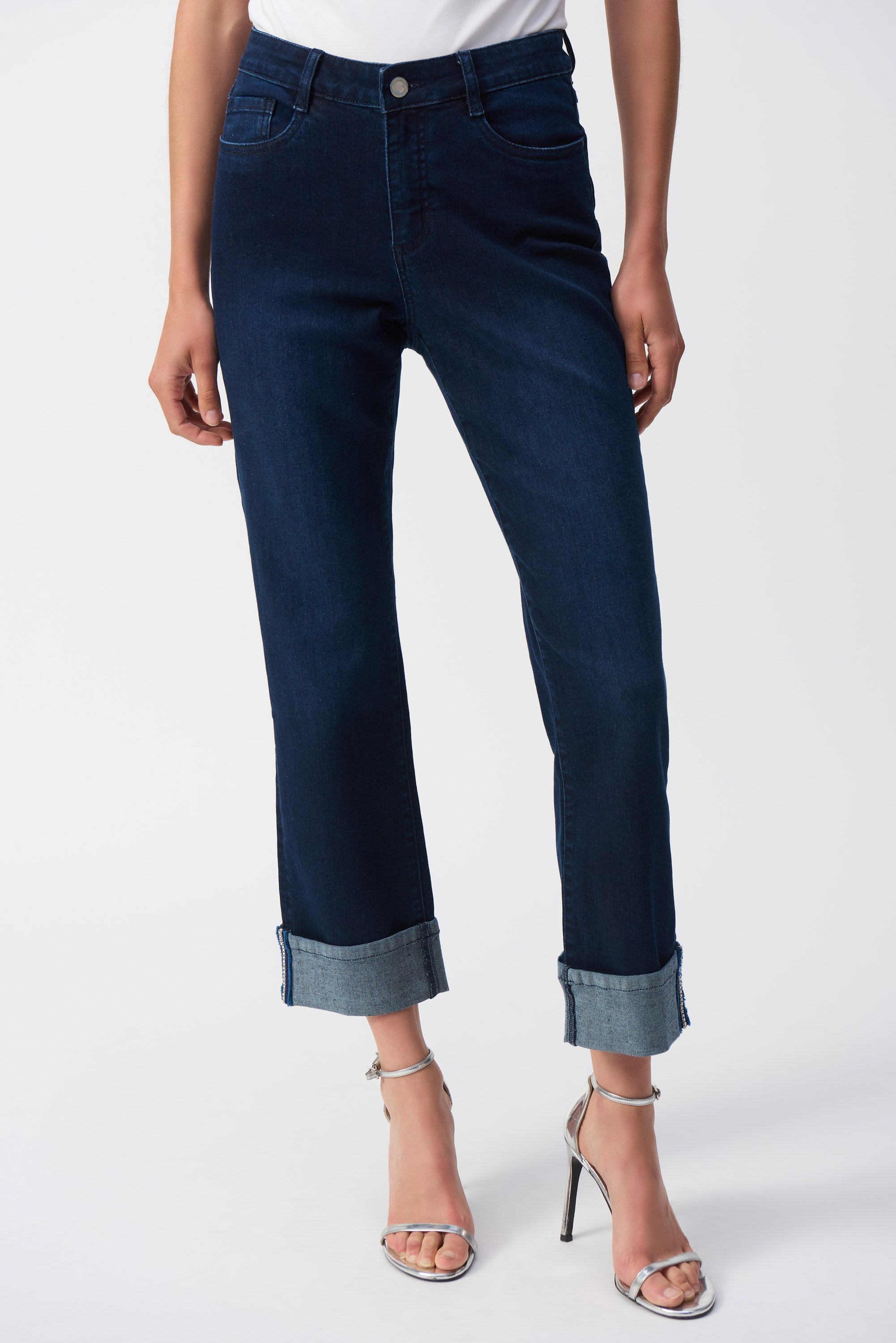 Pearls Boutique- Port Dover Ontario-Joseph Ribkoff- Effortless Jeans-251961-High-rise cropped straight-leg jeans with slight flare, made from stretch denim for comfort, dark wash, fly front, five-pocket styling, cuffed hem with cobalt blue stitch detail, versatile for casual or office wear.