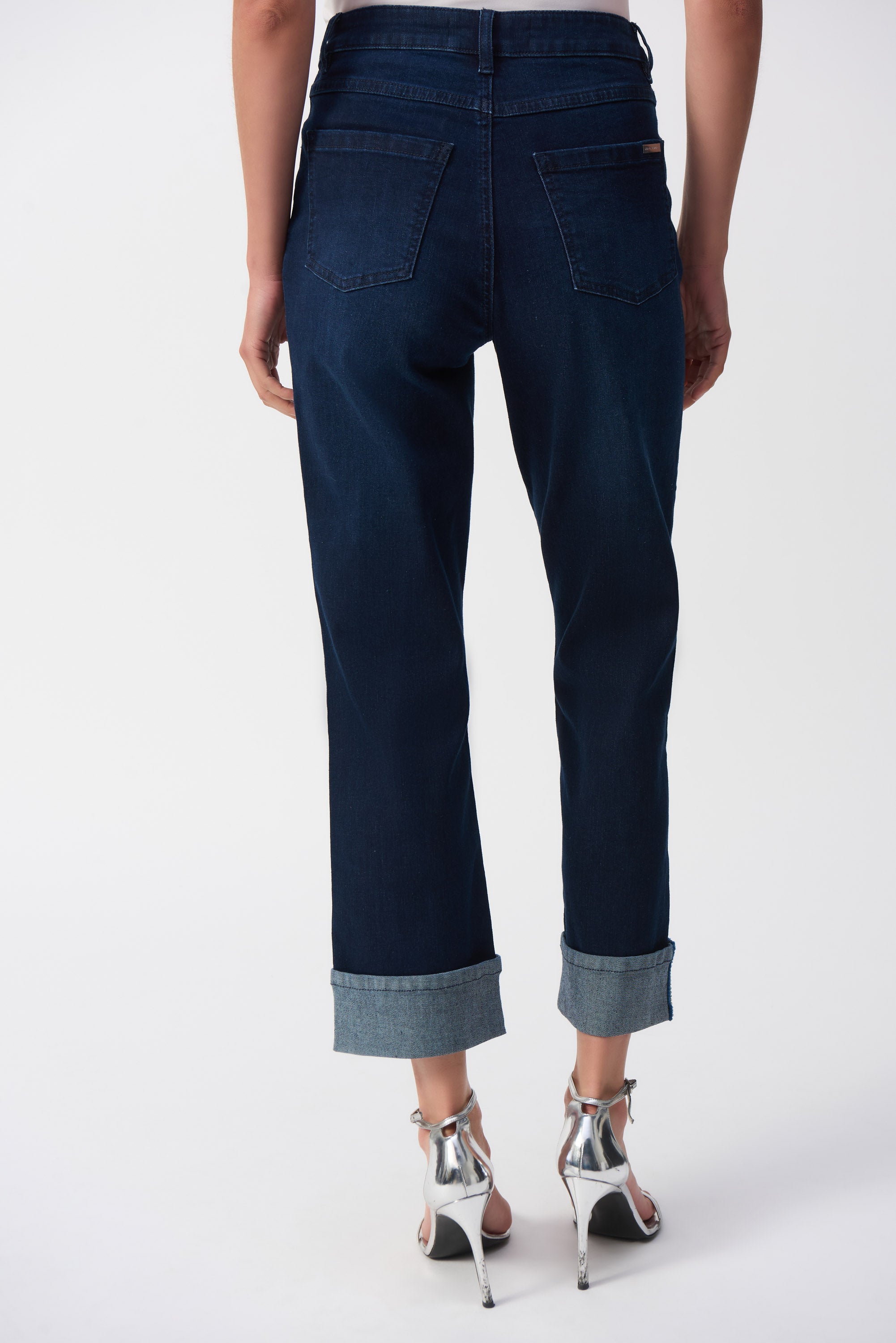 Pearls Boutique- Port Dover Ontario-Joseph Ribkoff- Effortless Jeans-251961-High-rise cropped straight-leg jeans with slight flare, made from stretch denim for comfort, dark wash, fly front, five-pocket styling, cuffed hem with cobalt blue stitch detail, versatile for casual or office wear.