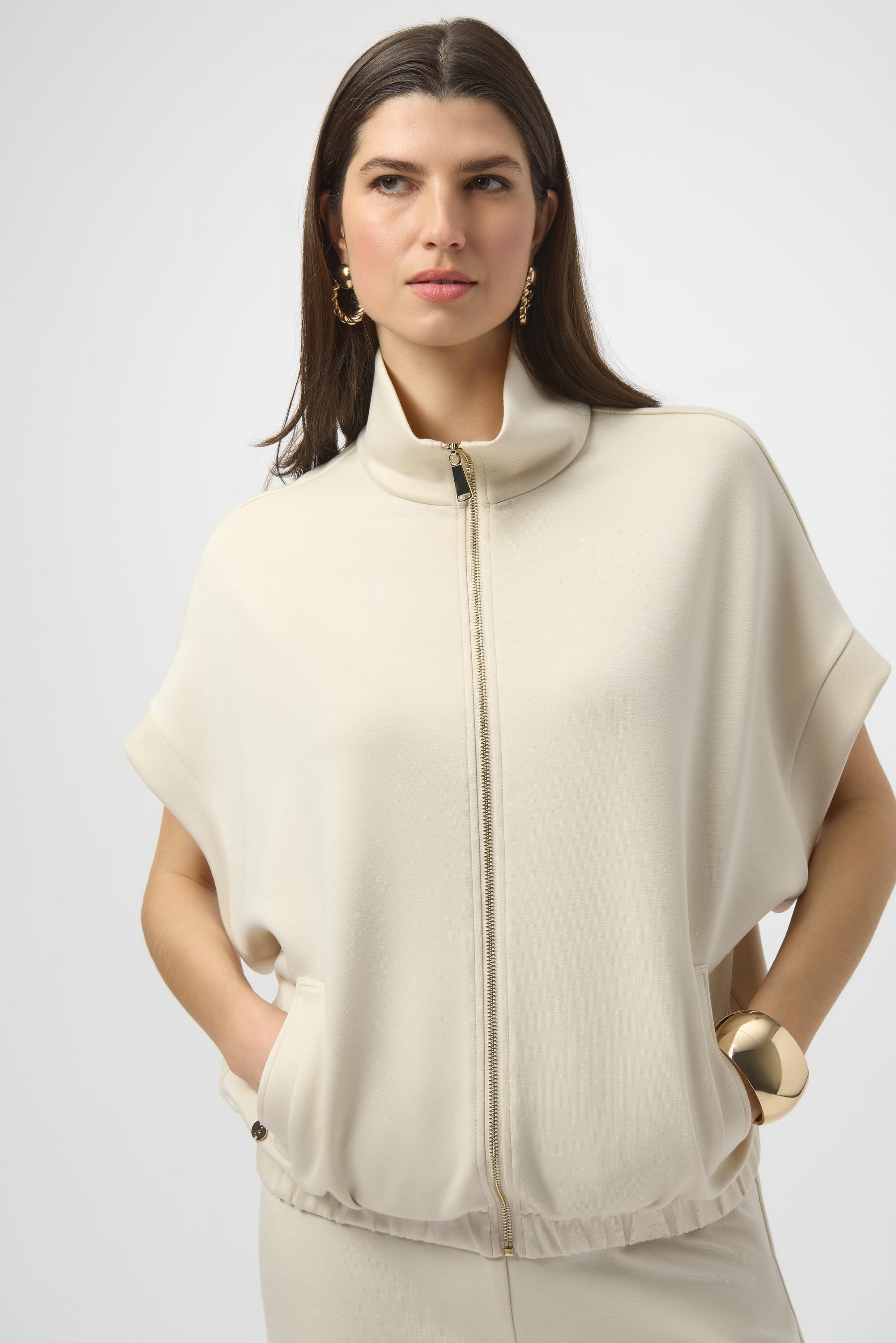 Pearls Boutique- Port Dover Ontario-Joseph Ribkoff- boxy scuba jersey jacket- 254145. colour birch. with short dolman sleeves, stand collar, front zip closure, welt pockets, and signature JR coin detail.

