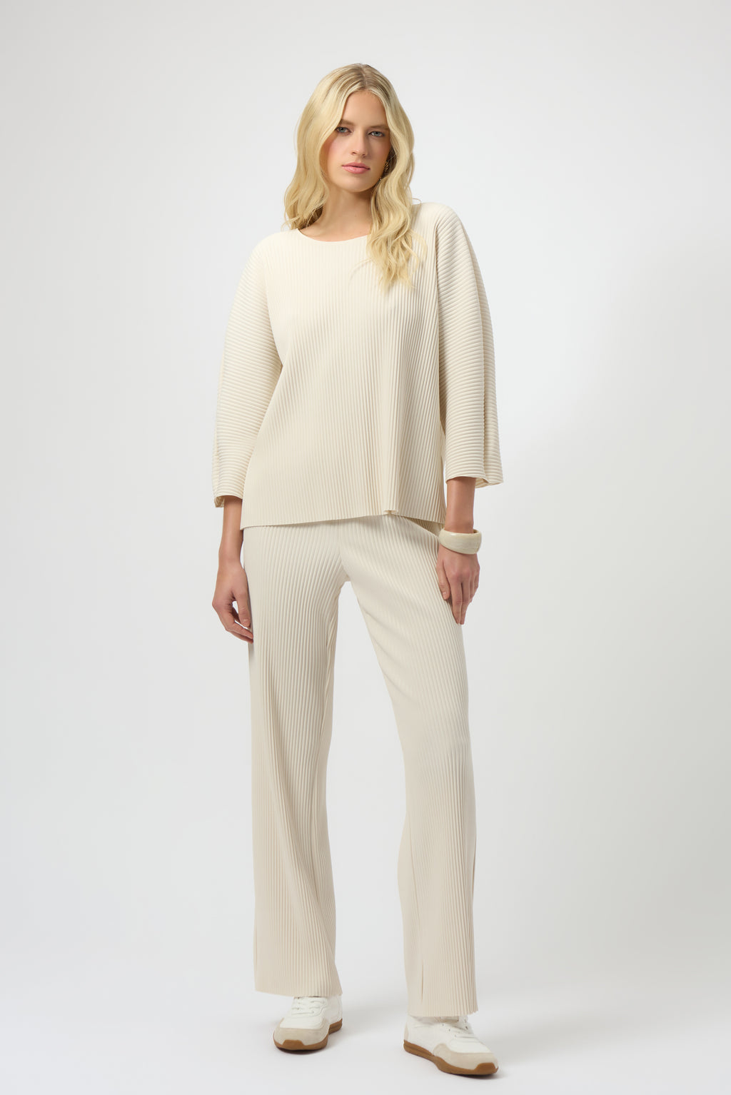 Pearls Boutique-Port Dover Ontario-Joseph Ribkoff | Pleated Scuba Crepe Boxy Top-Colour Birch
– Lightweight scuba crepe with subtle structure
– Delicate pleating for added movement and dimension
– Flattering scoop neckline with soft drape
– Three-quarter dolman sleeves for a contemporary finish
– Relaxed, boxy silhouette for all-day comfort