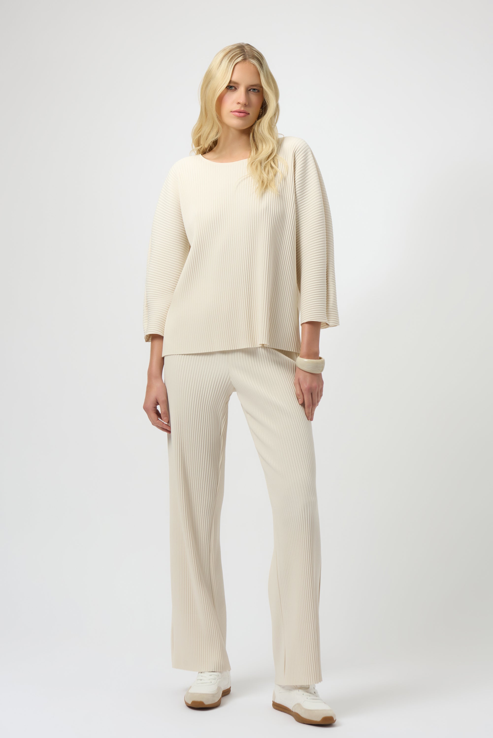 Pearls Boutique-Port Dover Ontario-Joseph Ribkoff | Pleated Scuba Crepe Boxy Top-Colour Birch
– Lightweight scuba crepe with subtle structure
– Delicate pleating for added movement and dimension
– Flattering scoop neckline with soft drape
– Three-quarter dolman sleeves for a contemporary finish
– Relaxed, boxy silhouette for all-day comfort