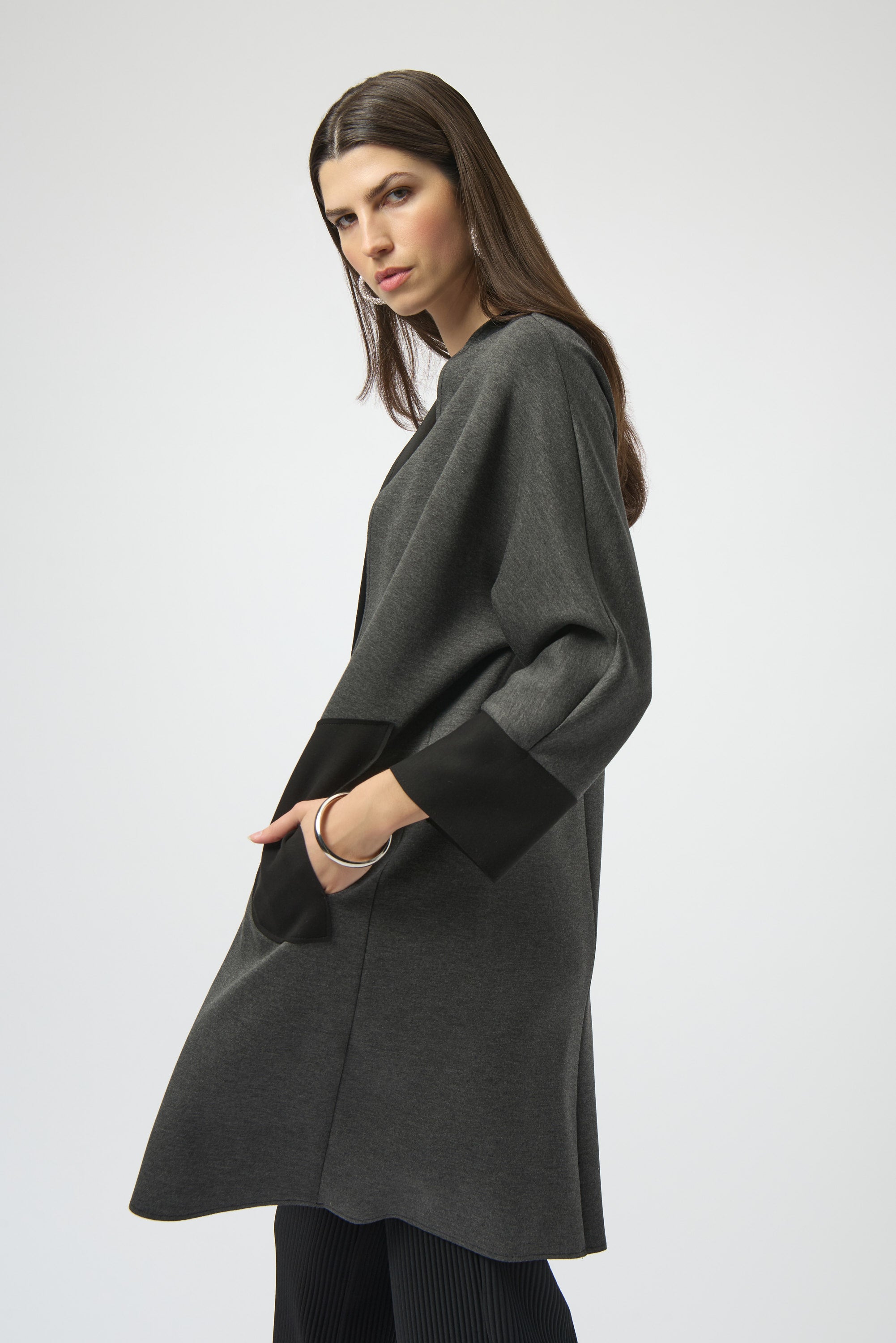 Pearls Boutique- Port Dover Ontario-Joseph Ribkoff | Scuba Jersey | Cover-Up-254040
Joseph Ribkoff mélange scuba jersey cover-up with V-neckline, long dolman sleeves, and patch pockets in a soft, structured knit.