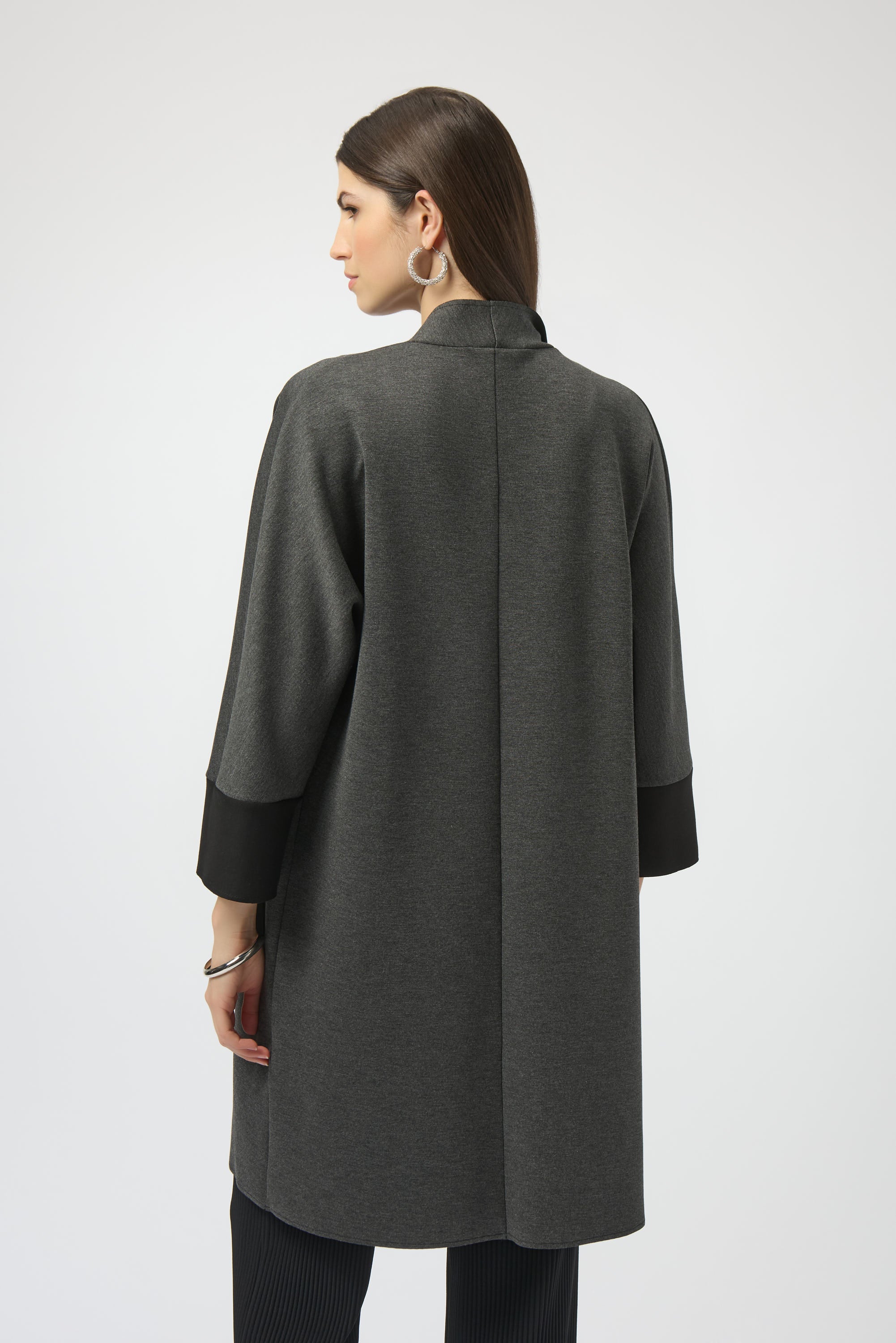 Pearls Boutique- Port Dover Ontario-Joseph Ribkoff | Scuba Jersey | Cover-Up-254040
Joseph Ribkoff mélange scuba jersey cover-up with V-neckline, long dolman sleeves, and patch pockets in a soft, structured knit.