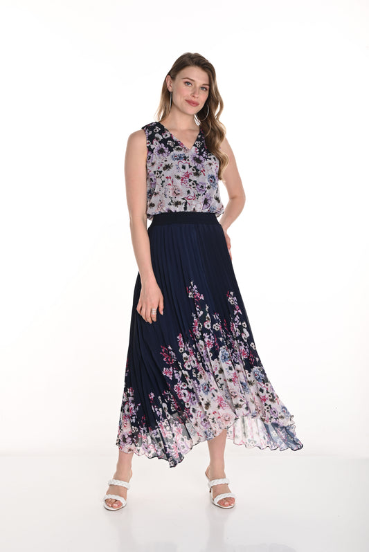 Pearls Boutique - Port Dover Ontario-Frank Lyman Floral Dress (Style 256712U) featuring a navy blue and blush floral pattern. This woven dress has a pleated skirt, relaxed fit, and flowing silhouette, v neckline, sleeveless,offering effortless elegance. Made from 100% polyester, it is lightweight and perfect for spring celebrations. Crafted in Canada