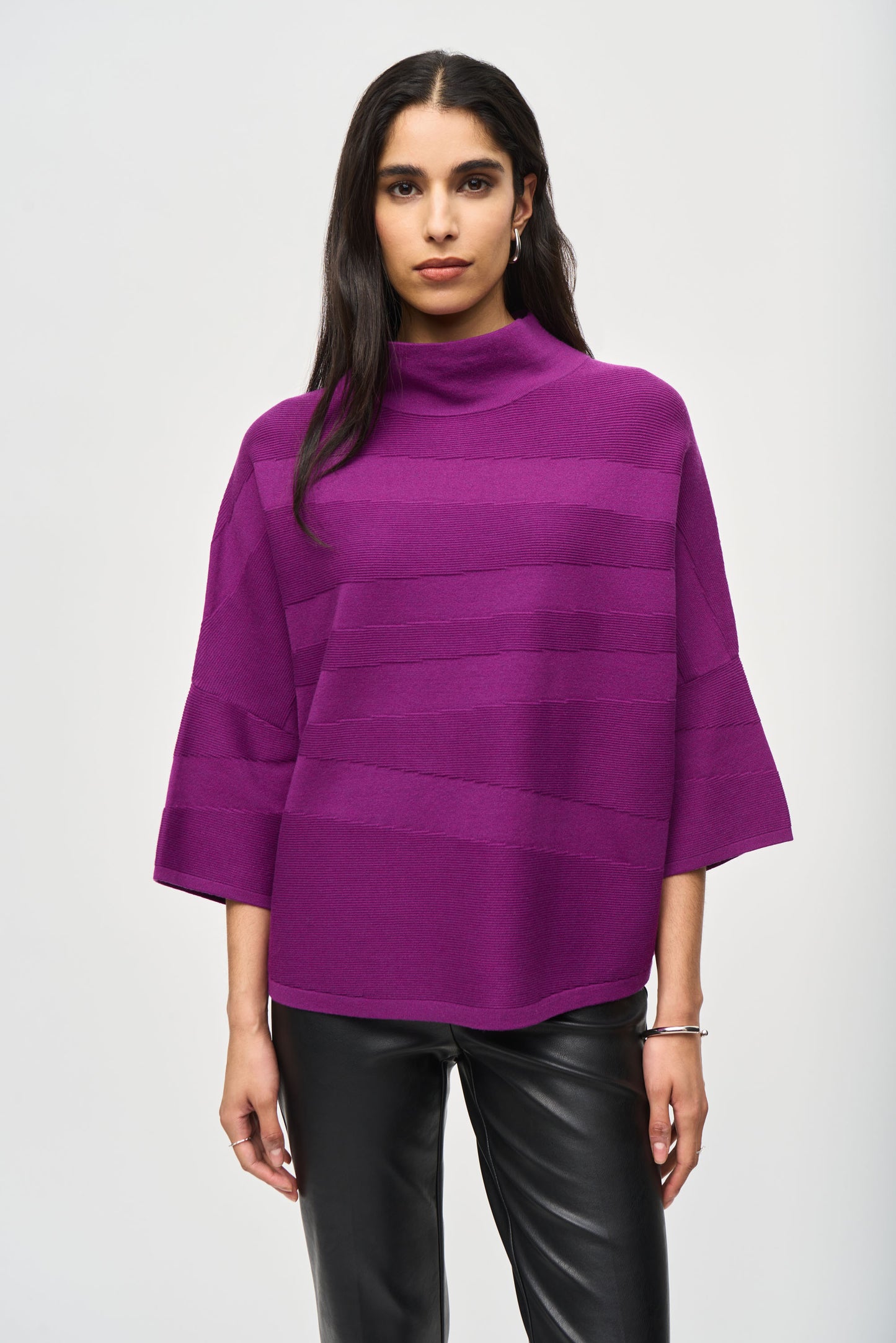 Pearls Boutique Port Dover Ontario-Joseph_RIbkoff-Knit Mock Neck Sweater-243953 colour Empress (purply pink)
3/4 sleeves,  mock neckline. 
Luxe Comfort: Elevates cozy chic beyond bulky sweatshirts and sweatpants
Versatile: Pair with jeans and heels for brunch or leggings for a night in
Day-to-night transition: Effortlessly shifts from casual to cozy
Simple Sophistication: Clean lines and uncluttered design
Timeless piece that blends comfort with style