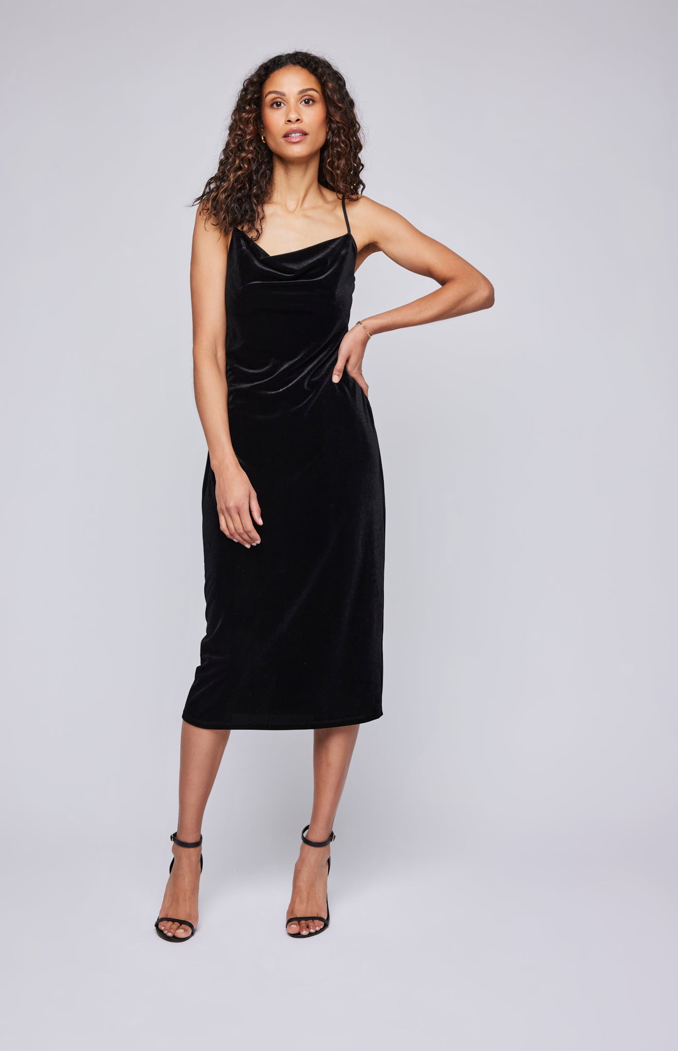 Pearls Boutique - Port Dover Ontario-  Gentle Fawn-Jolene Dress – Holiday Must-Have:

Luxurious soft velvet for a festive touch
Delicate spaghetti straps
Gracefully draped cowl neckline
Flattering, feminine fit
Perfect for holiday parties, evening events, and date nights
Pair with heels for a timeless, sophisticated look
Chic, polished style for the holiday season