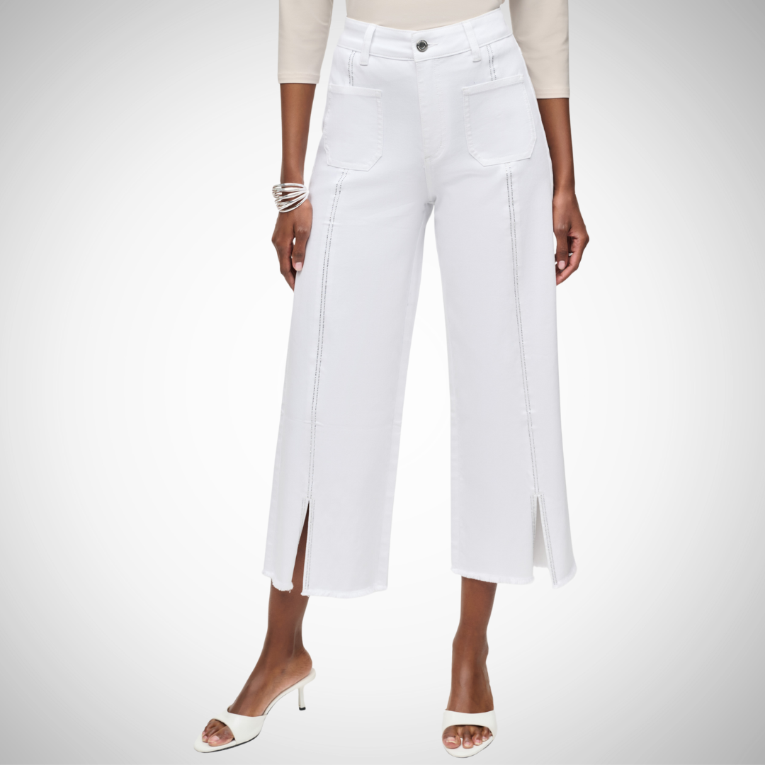 Pearls Boutique - Port Dover Ontario - Joseph Ribkoff - Wide Leg Cropped Jeans. Revamp your wardrobe with Wide Leg Cropped Jeans Flirty embellished front slit seam at the hemline Cool Welder Jean styling Fly front Made with a comfy blend: 70% cotton 25% polyester 3% viscose rayon 2% spandex Fun, fashionable, and functional! Colour White