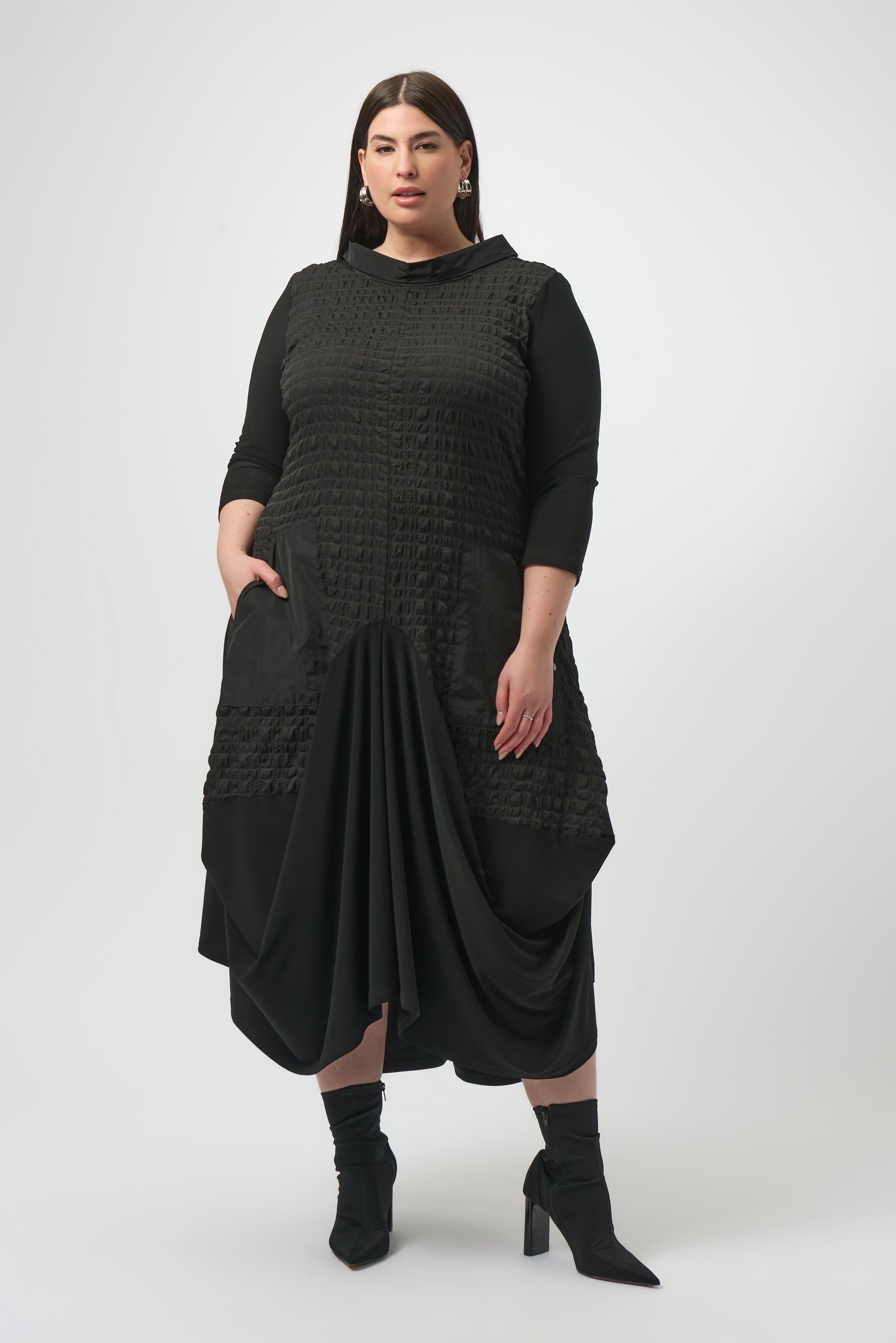 Pearls Boutique| Port Dover Ontario |Joseph Ribkoff | Bubble Jacquard  Silky Knit Cocoon Dress| colour black.
A-line silhouette with a fluid, graceful drape that flatters every movement
Silky knit base with luxe bubble jacquard and memory fabric accents for sculptural texture
Soft cowl neckline adds a touch of understated drama
Three-quarter sleeves designed to balance structure with effortless ease
Functional front pockets for a blend of chic style and everyday practicality
Back zipper closure