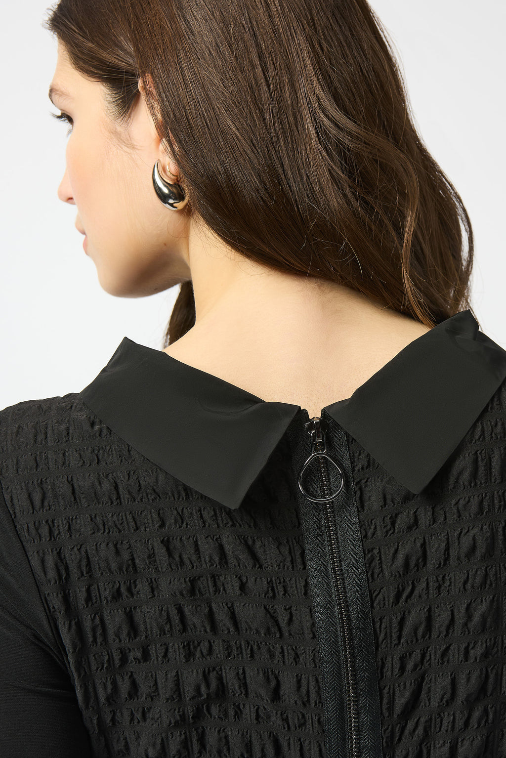 Pearls Boutique| Port Dover Ontario |Joseph Ribkoff | Bubble Jacquard  Silky Knit Cocoon Dress| colour black.
A-line silhouette with a fluid, graceful drape that flatters every movement
Silky knit base with luxe bubble jacquard and memory fabric accents for sculptural texture
Soft cowl neckline adds a touch of understated drama
Three-quarter sleeves designed to balance structure with effortless ease
Functional front pockets for a blend of chic style and everyday practicality
Back zipper closure