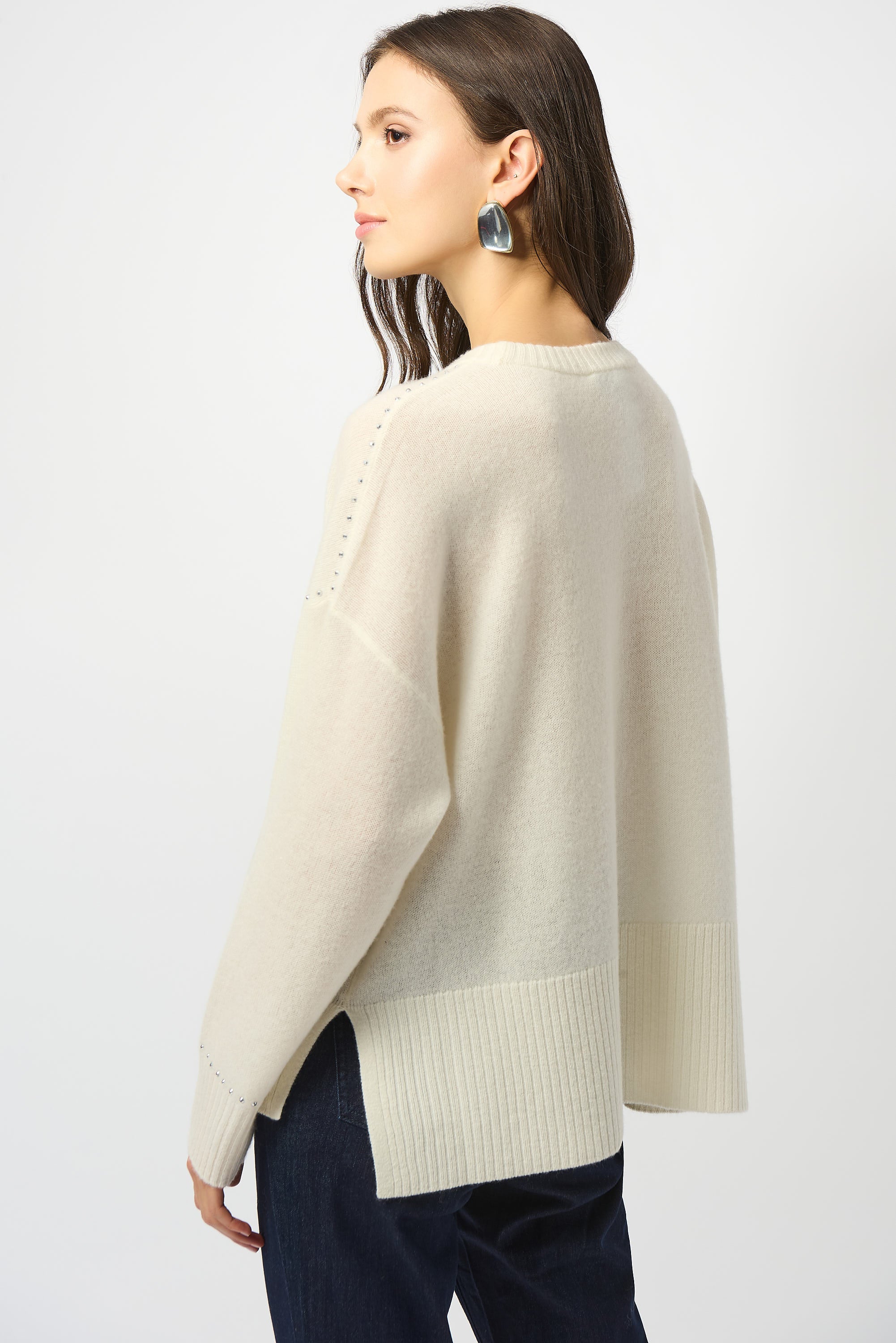 Pearls Boutique Port Dover Ontario Joseph Ribkoff Cashmere Crew Neck Top with Stud Detailing. 100% cashmere sweater with a classic crew neckline, long straight sleeves, and subtle stud detailing, crafted from ultra-soft, fine-grade cashmere for a luxurious and lightweight feel. Colour Winter White 

