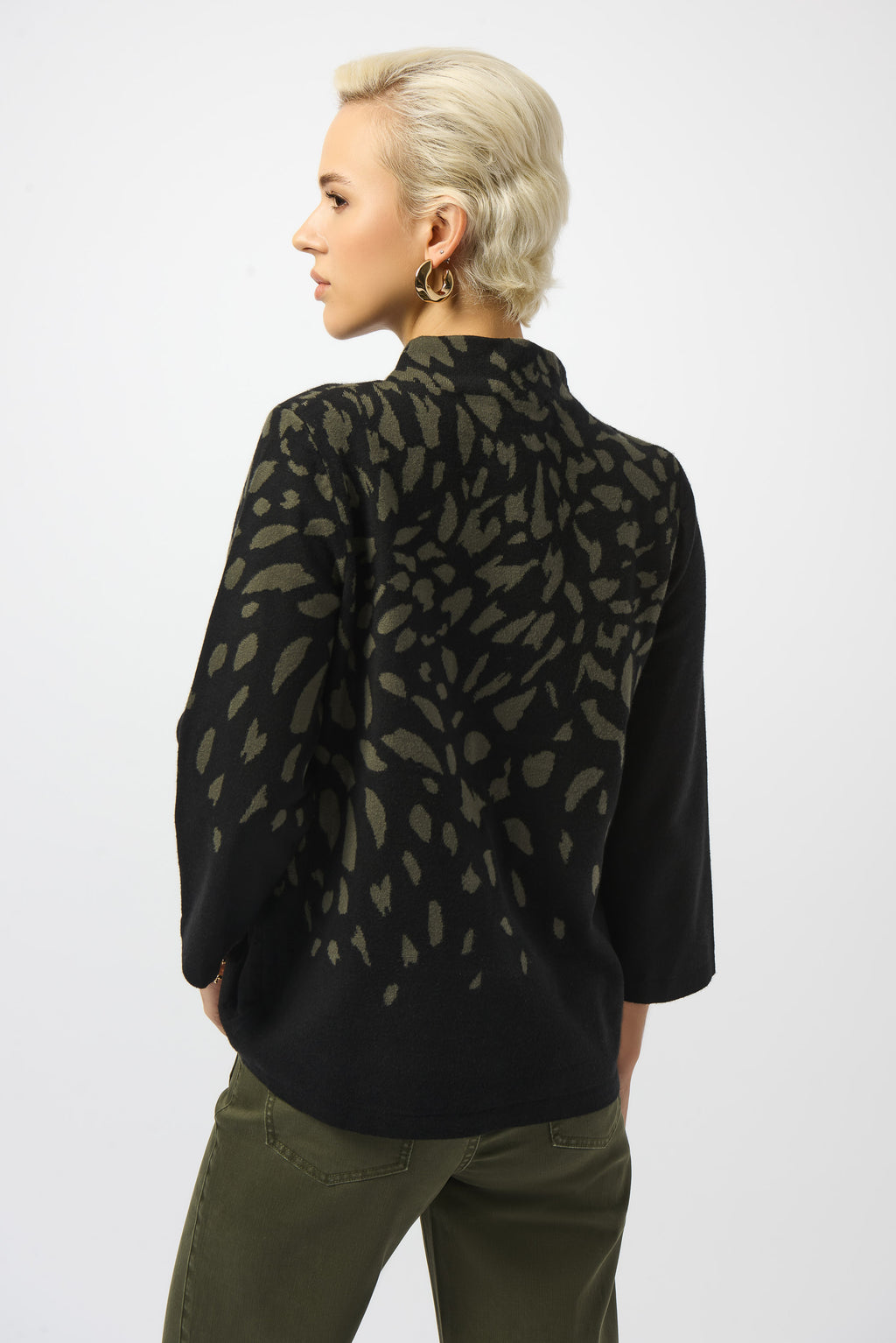 Pearls Boutique | Port Dover Ontario |Joseph Ribkoff |Jacquard Animal Print Sweater. Luxurious jacquard sweater knit with soft, breathable texture
Bold animal print in a dynamic Black/Avocado colourway
Mock neckline for an elevated, cozy silhouette
Three-quarter straight sleeves for a balanced, structured fit
Rhinestone detailing for a refined, touch-of-sparkle finish.