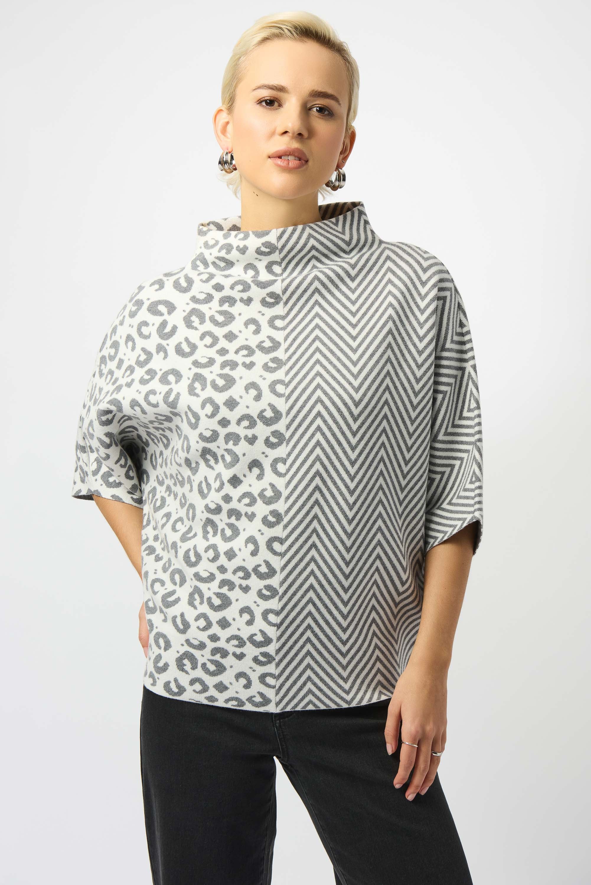 Pearls Boutique Port Dover Ontario Joseph Ribkoff Jacquard Knit Mixed Print Boxy Sweater 253981-3653 
Jacquard sweater top in soft light grey and winter white, featuring a bold half animal print and half herringbone design, with a funnel neck, relaxed boxy silhouette, and three-quarter dolman sleeves, crafted from a luxurious viscose-rich knit for a soft, textured feel.