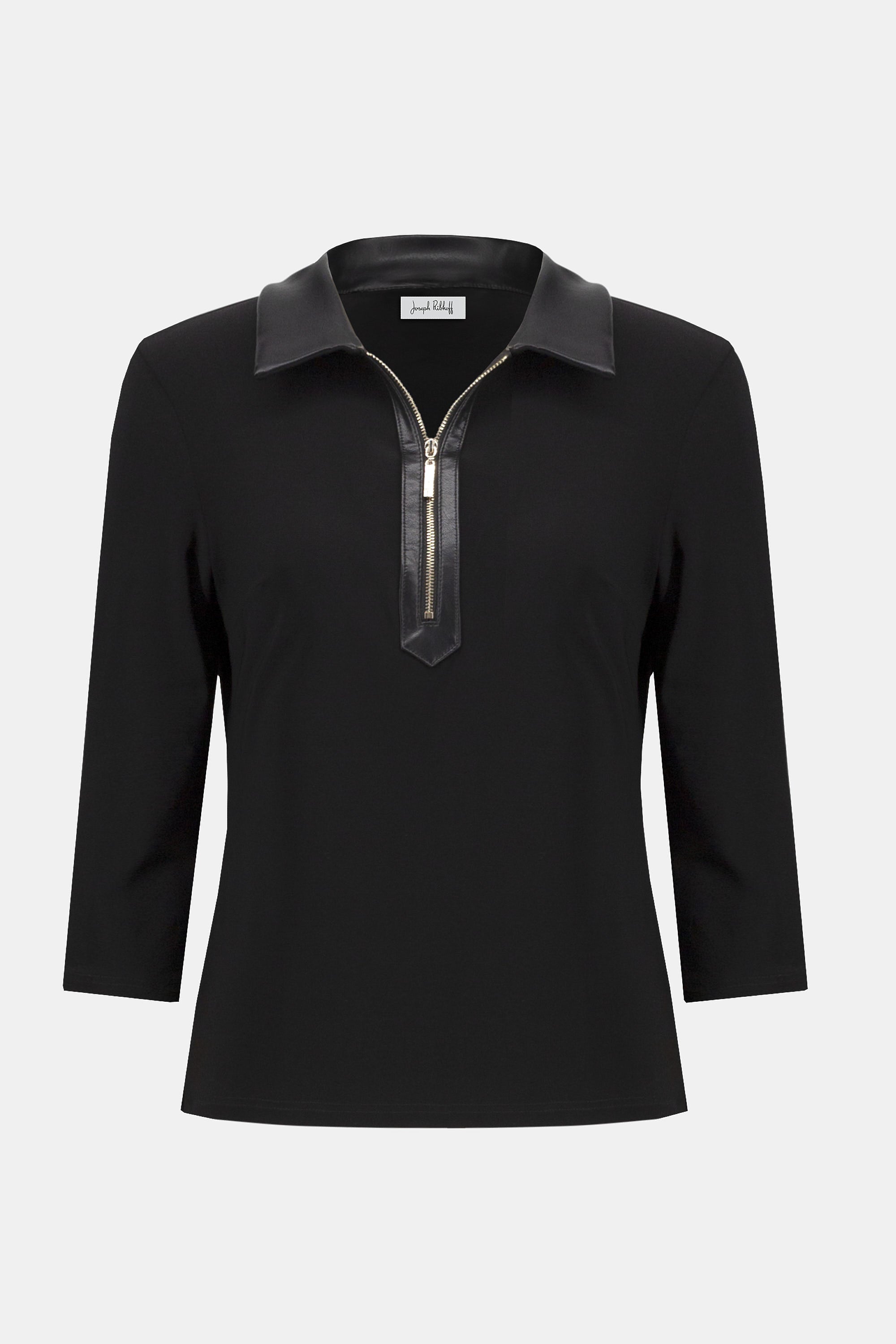 Pearls Boutique Port Dover Ontario Joseph Ribkoff Silky Knit and Leatherette Fitted Top. colour Black Fitted silhouette designed to contour and flatter
Silky knit fabric with a soft, fluid feel
Bold shirt collar with leatherette detailing for modern sophistication
Front placket with zipper accent for a sleek, contemporary edge
Three-quarter sleeves offering a balanced, polished look
Unlined for lightweight, effortless wear