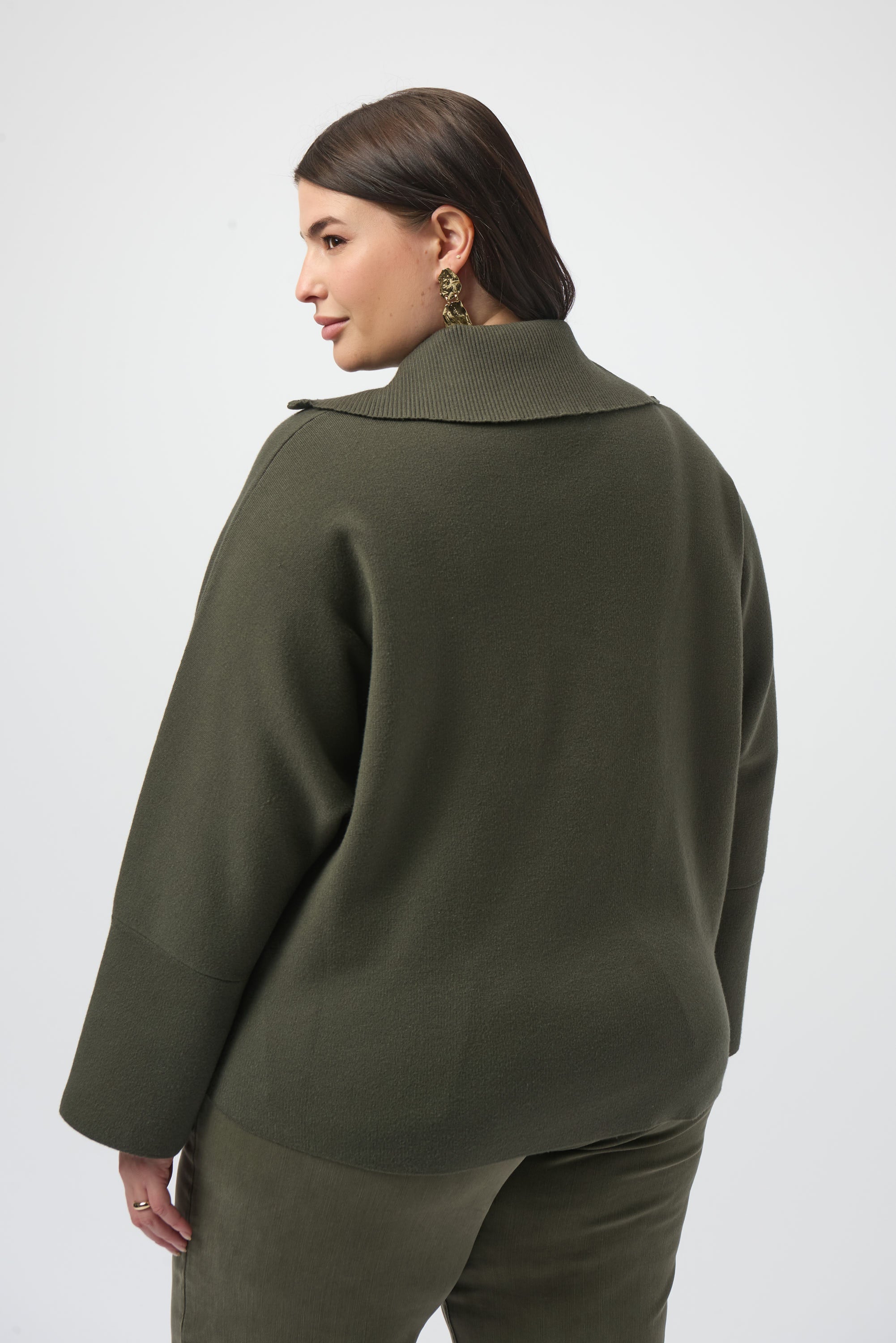 Pearls Boutique Port Dover Ontario Joseph_Ribkoff_Sweater_Knit_Boxy_Pullover_With_Zipped_Collar_253963-Soft sweater knit pullover with a relaxed boxy fit, featuring a modern zipped front neckline and elegant three-quarter bell sleeves that add graceful movement to the silhouette. colour Avocado Green.

