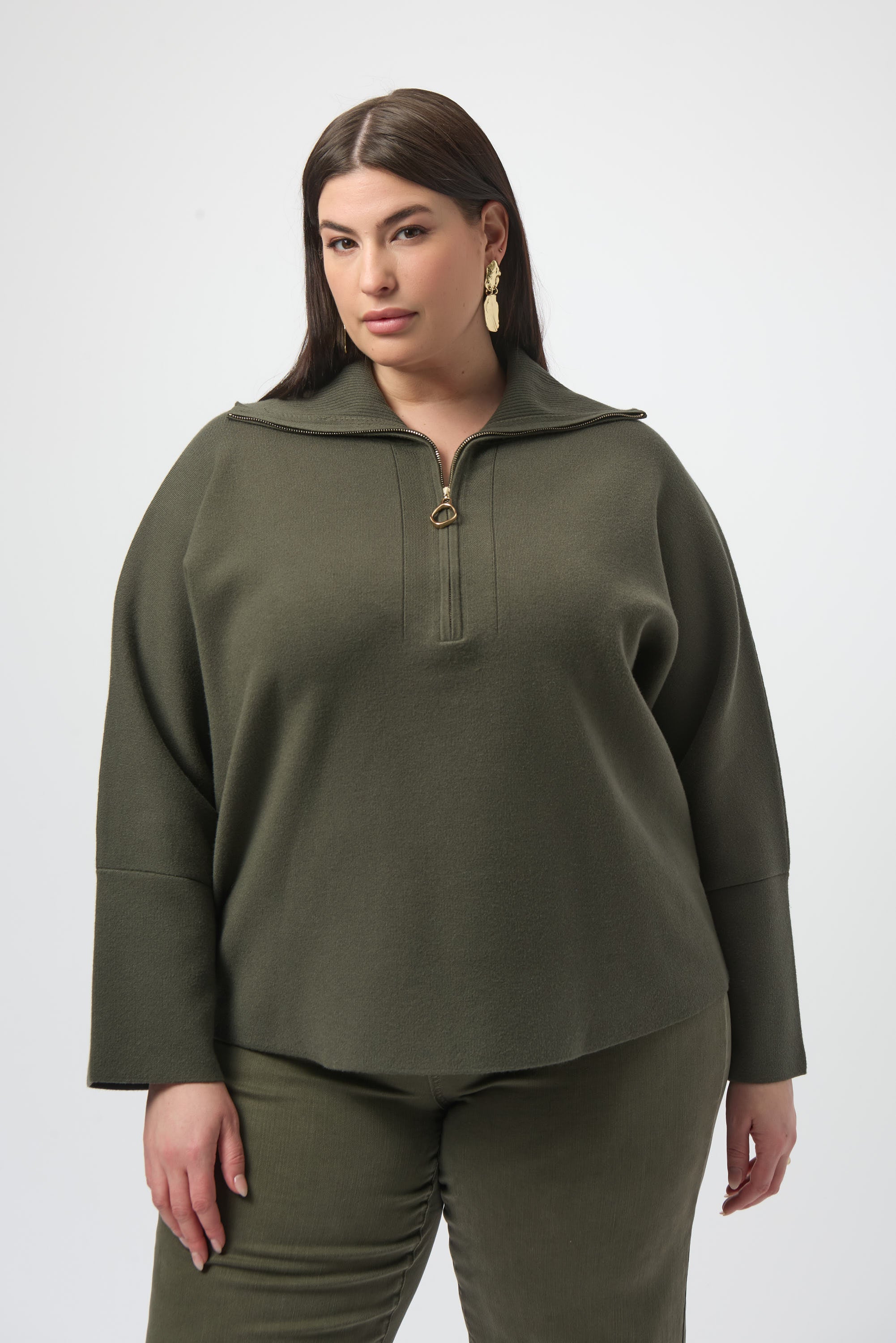 Pearls Boutique Port Dover Ontario Joseph_Ribkoff_Sweater_Knit_Boxy_Pullover_With_Zipped_Collar_253963-Soft sweater knit pullover with a relaxed boxy fit, featuring a modern zipped front neckline and elegant three-quarter bell sleeves that add graceful movement to the silhouette. colour Avocado Green.

