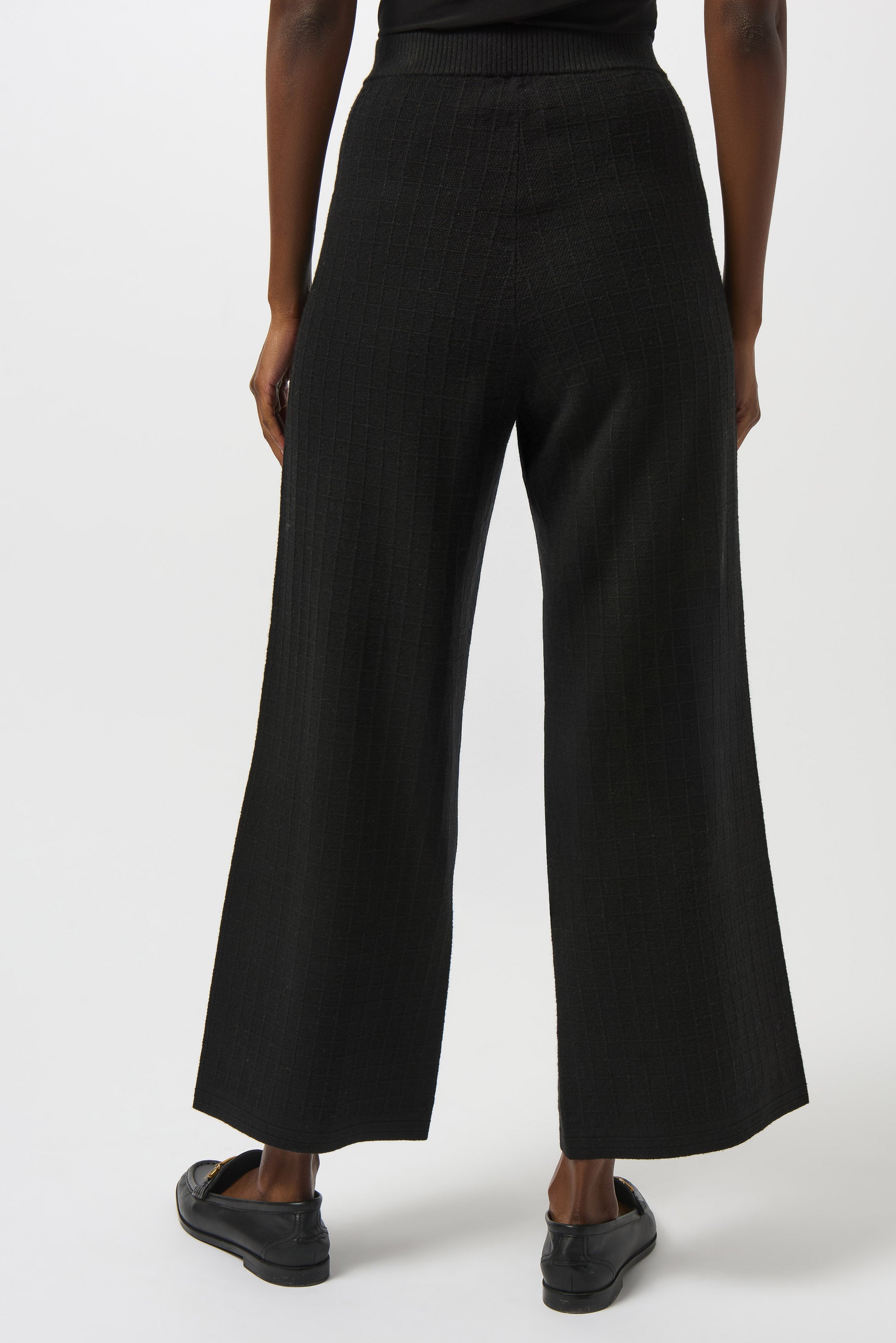 Pearls Boutique | Port Dover Ontario | Joseph Ribkoff | Sweater Knit Straight Leg Pants | 253984-11 | colour black. 
Pull one, high rise, straight leg, Luxe viscose-blend sweater knit for a soft, structured feel

High-rise pull-on waistband for seamless comfort and sleek lines

Straight-leg cut that elongates the silhouette

Front patch pockets for a modern tailored detail

Lightweight and unlined for breathable wear

50% Viscose Rayon, 28% Polyester, 22% Nylon