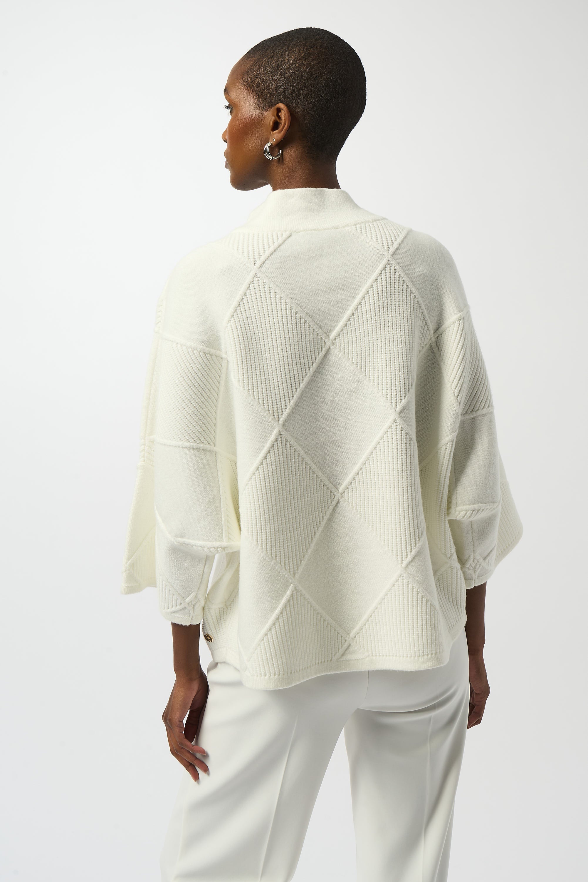 Pearls Boutique Port Dover Ontario Joseph Ribkoff Textured Sweater Knit Mock Neck Pullover 253943
Premium sweater knit with an intricate diamond texture
Mock collar for a modern, streamlined neckline
Long bell sleeves for elegant drape and fluid movement
Tailored fit with a soft, comfortable feel

Made from a rich blend of viscose, polyester, and nylon, this sweater offers a soft hand-feel with breathable warmth.