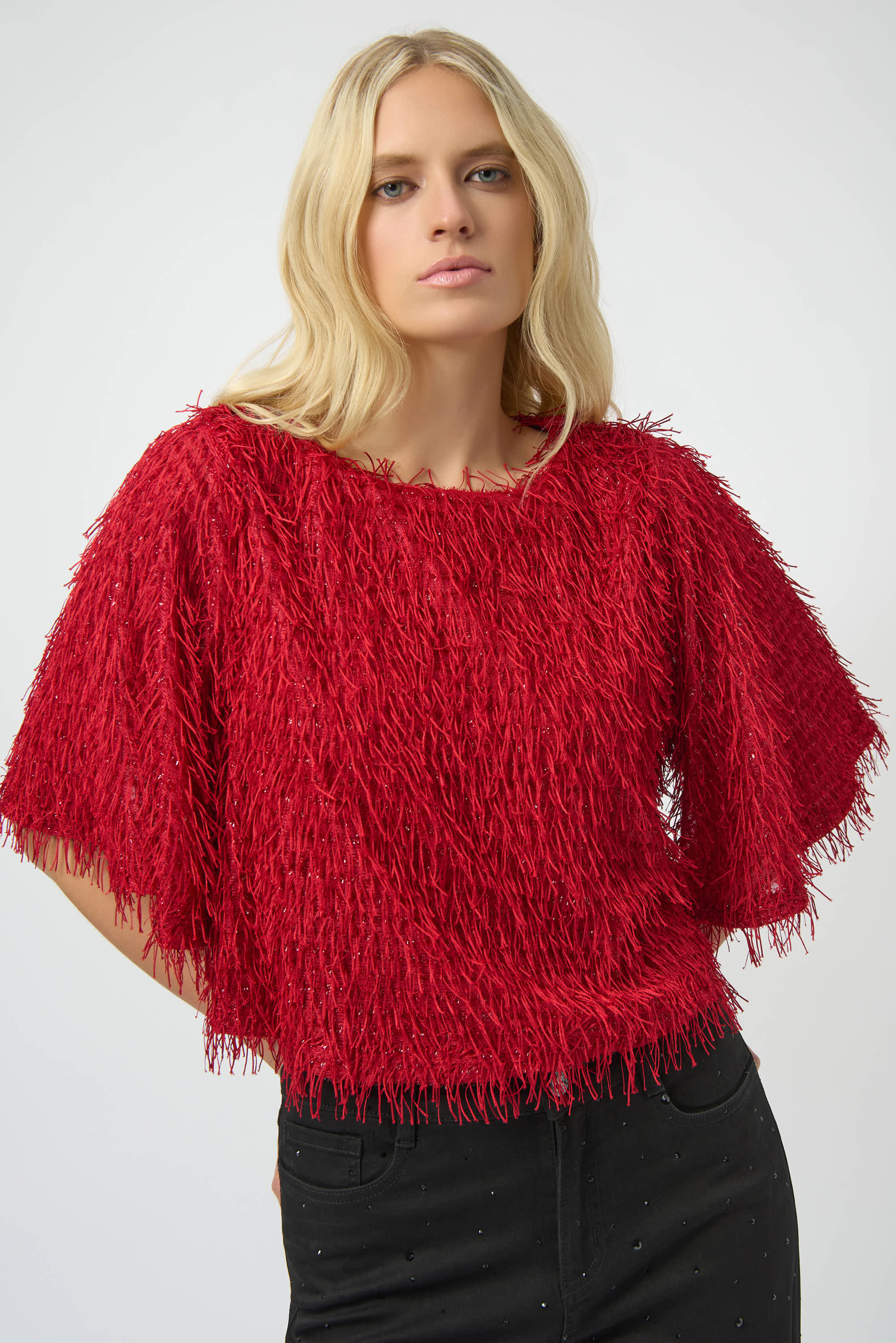 Pearls Boutique| Port Dover Ontario| Joseph Ribkoff | novelty fringe boxy crop top | Colour Red.
Unique fringe knit fabric for eye-catching texture

Boxy crop silhouette for a contemporary edge

Long bell sleeves that add volume and drama

Lightweight and unlined for breathable comfort
