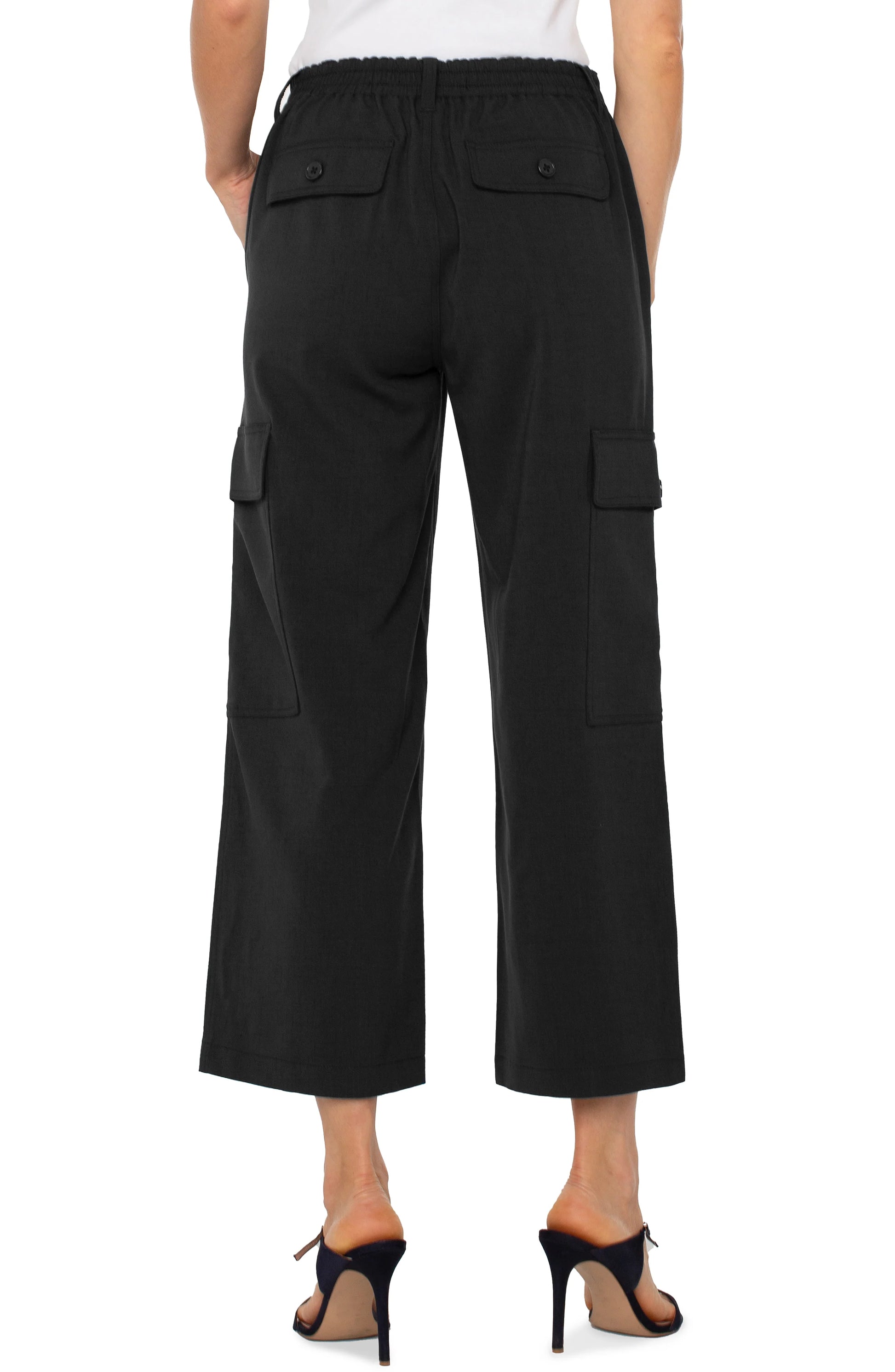 Pearls Boutique | Port Dover Ontario Liverpool | Hi-rise cargo crop pants |  in black textured stretch-woven fabric

Straight-leg silhouette with a flattering fit

Elastic back waistband for added comfort

Zip-fly with single button closure

Slash side pockets and back flap pockets with button closures

Cargo side pockets with button closures

26" inseam, 10-1/8" front rise, 19-3/4" leg opening

Lightweight and durable fabric (47% Rayon, 50% Polyester, 3% Spandex)