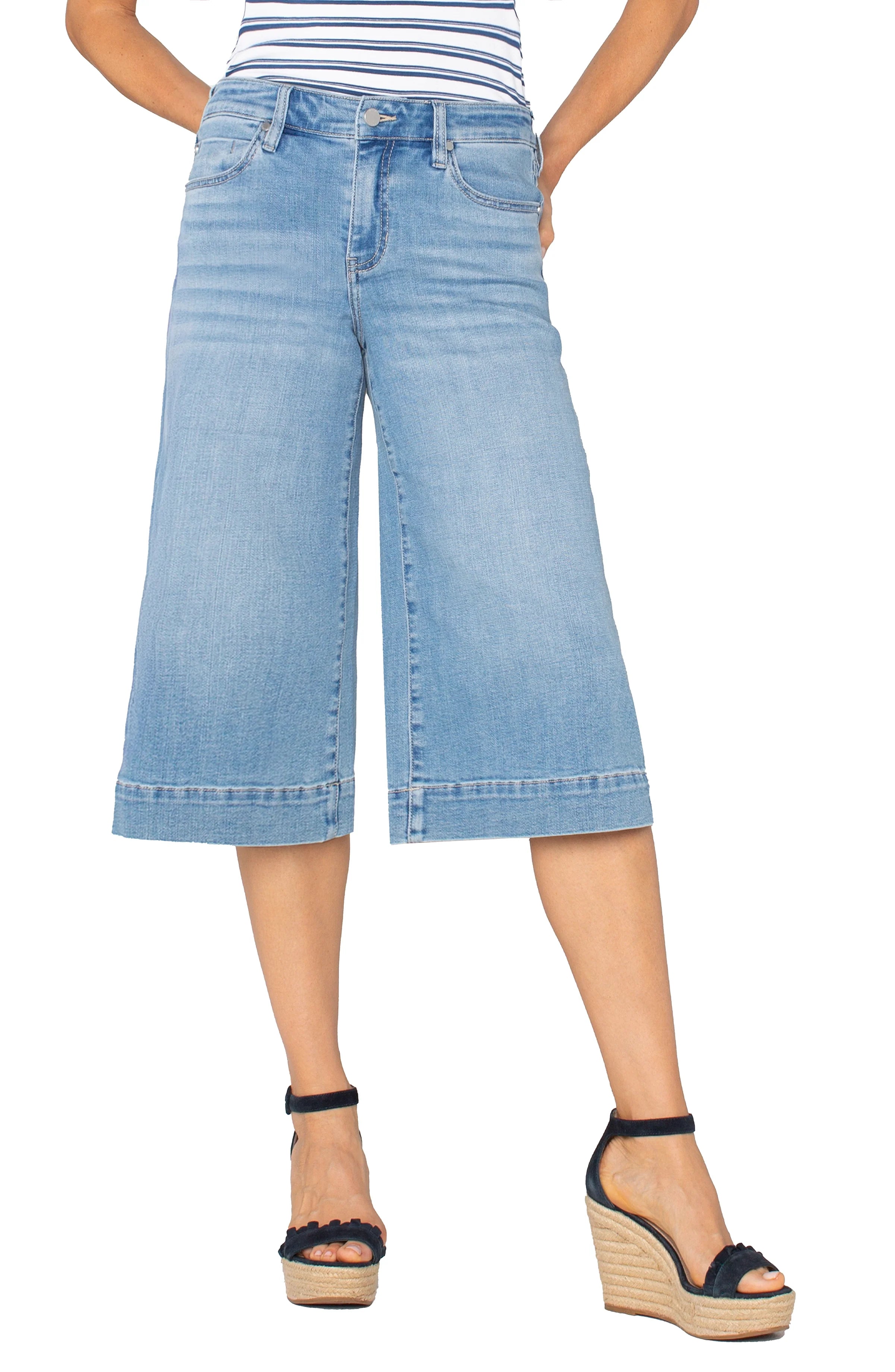 Pearls Boutique|Port Dover Ontario|Liverpool|Mid-rise cropped yacht culotte pants| colour Abbot Kinney(distressed med blue wash) in premium denim

19" inseam, 9-1/8" front rise, 24" leg opening for size 4

Set-in waistband with belt loops

Zip-fly with button closure

Slanted side pockets and flap back pockets with button closures

Relaxed yet refined culotte silhouette

Soft, stretchy fabric blend (63% Cotton, 21% Lyocell, 14% Polyester, 2% Elastane)








