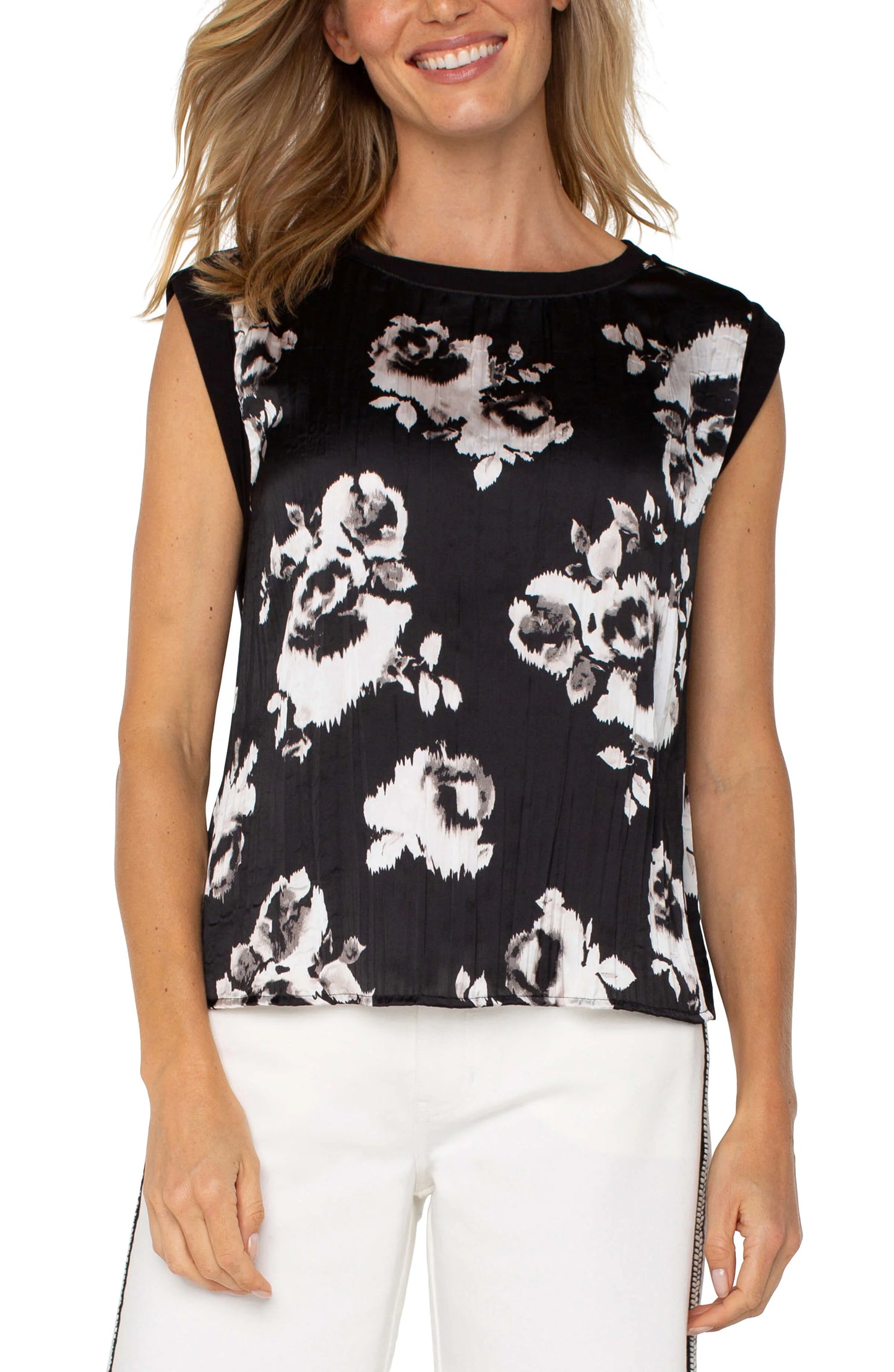 Pearls Boutique|Port Dover Ontario|Liverpool|Sleeveless woven knit top with a black and white floral print

Subtle pleated texture adds depth and elegance

Soft, flowy fabric with a relaxed fit

Double-layer folded sleeves for a polished finish

Round neckline with a clean, minimalist design

Lightweight and breathable for versatile styling