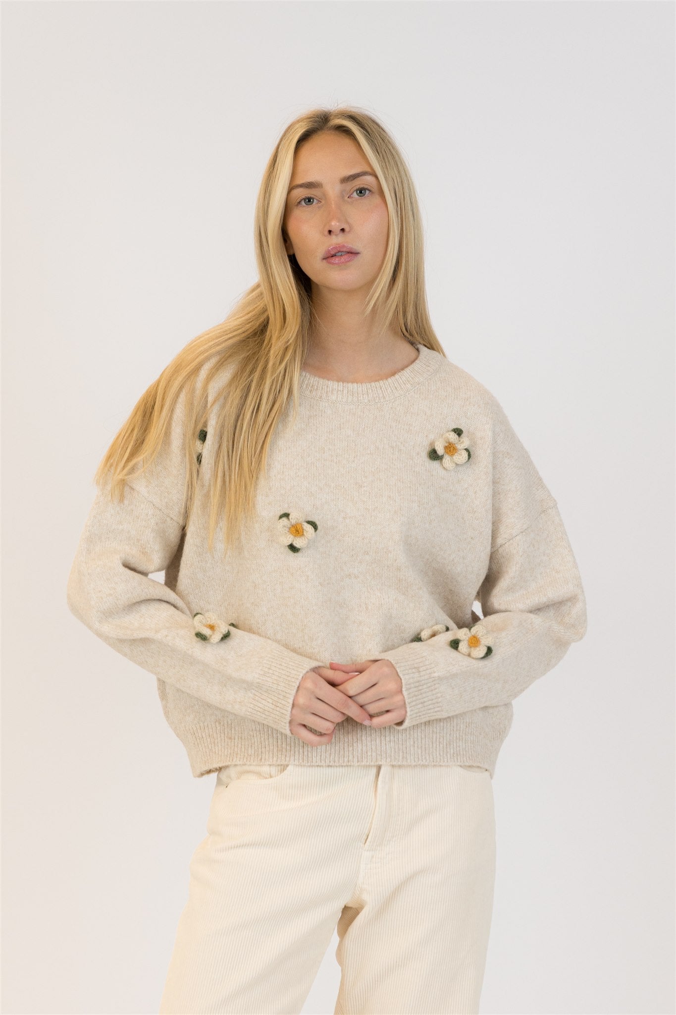 Pearls Boutique| Port Dover Ontario| Lyla +Lux| Holly Oat Crewneck Sweater. Lyla + Lux women’s crewneck pullover sweater crafted from a soft blend of polyester, acrylic, polyamide, and wool. Features intricate floral embroidery across the front, a classic crew neckline, and long sleeves. The lightweight yet cozy knit offers a relaxed, flattering fit, perfect for layering under outerwear or wearing on its own for a feminine, polished look.